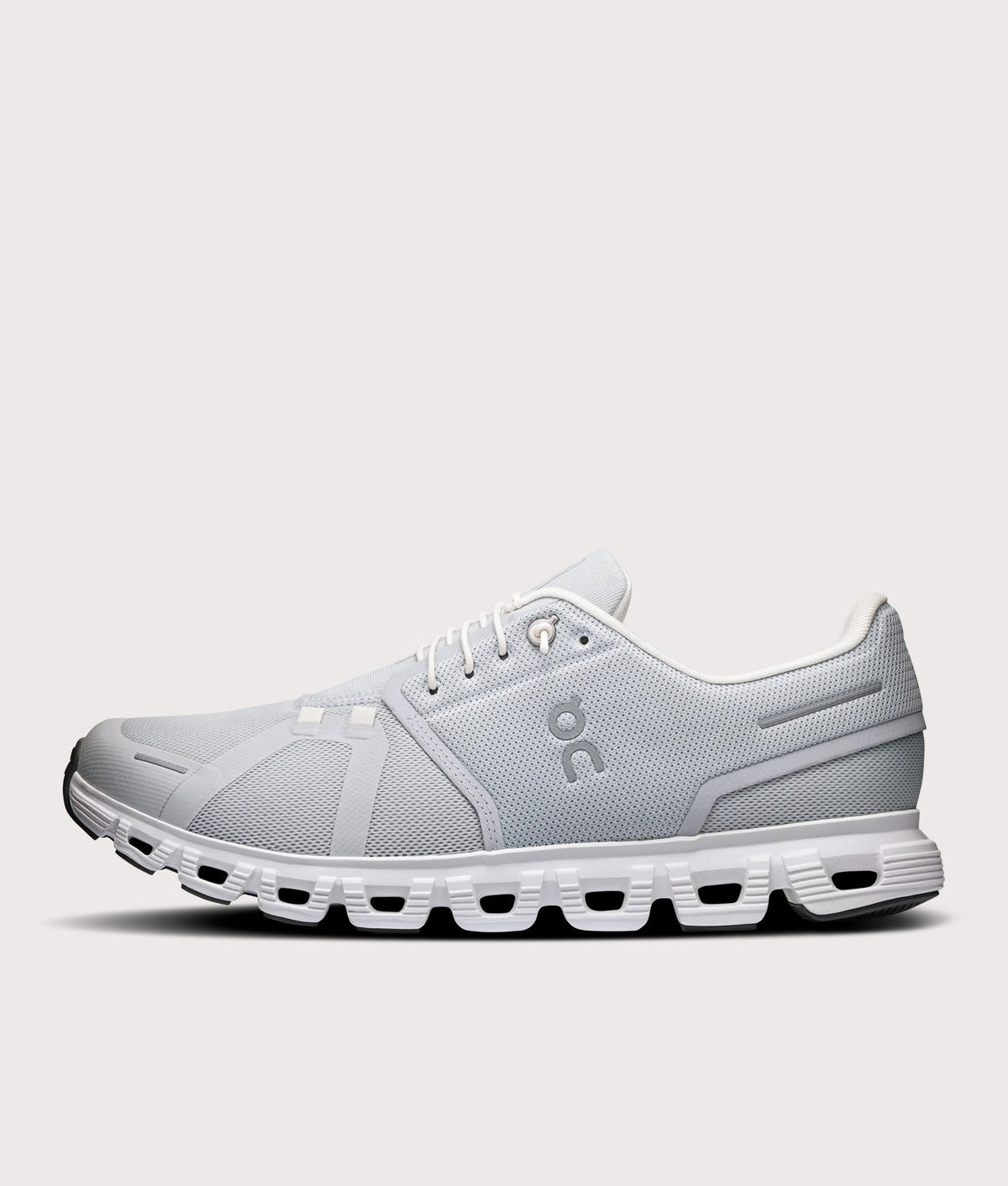 On Cloud 6 Sneakers in Glacier and White at EQVVS Menswear. Side shot.