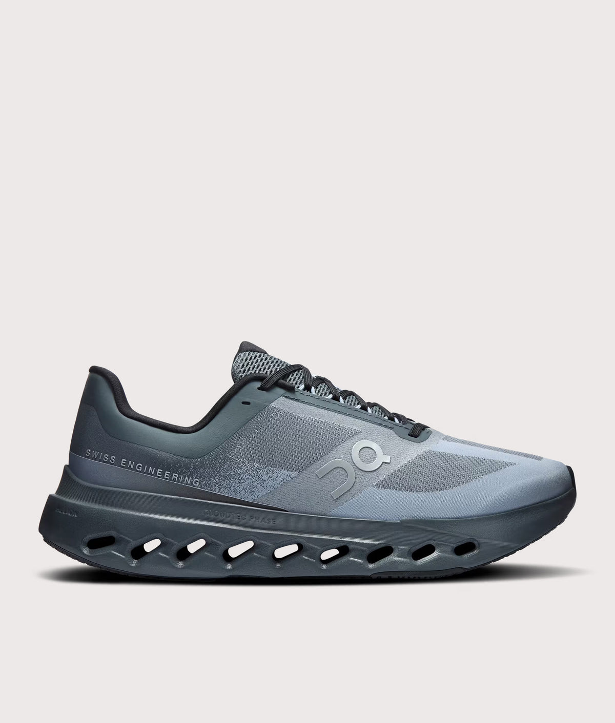 On Cloudsurfer Next Sneakers in Stone/Marsh at EQVVS Menswear. Side shot.