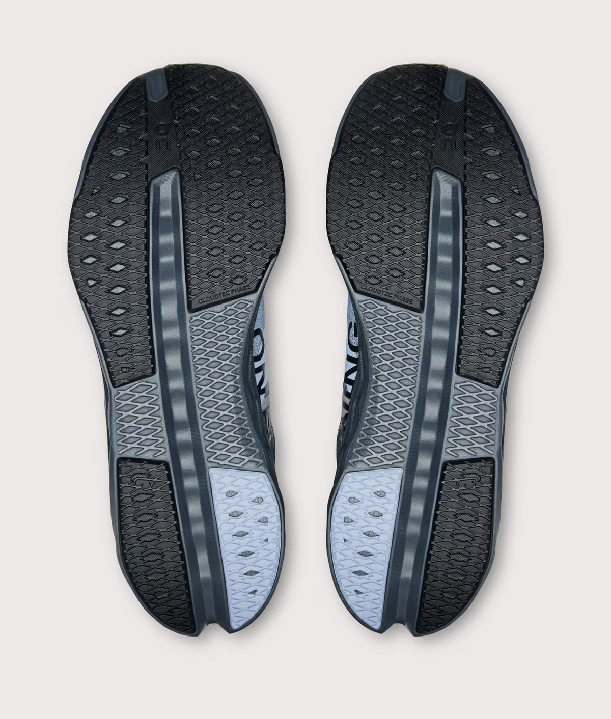 On Cloudsurfer Next Sneakers in Stone/Marsh at EQVVS Menswear. Tread shot.