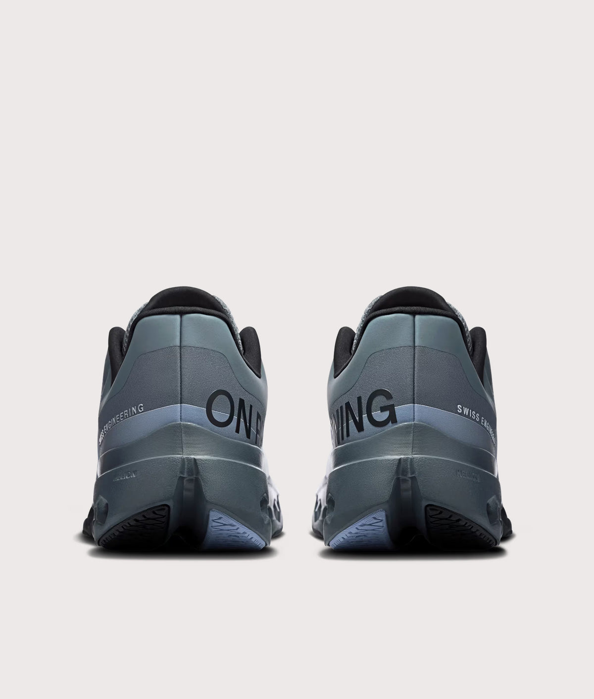 On Cloudsurfer Next Sneakers in Stone/Marsh at EQVVS Menswear. Back shot.