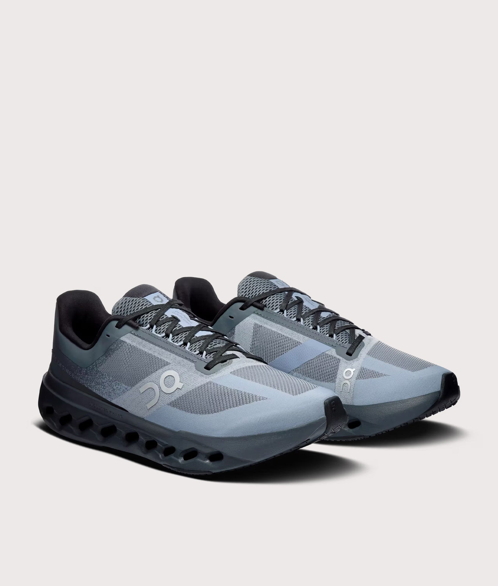 On Cloudsurfer Next Sneakers in Stone/Marsh at EQVVS Menswear. Angled front shot.