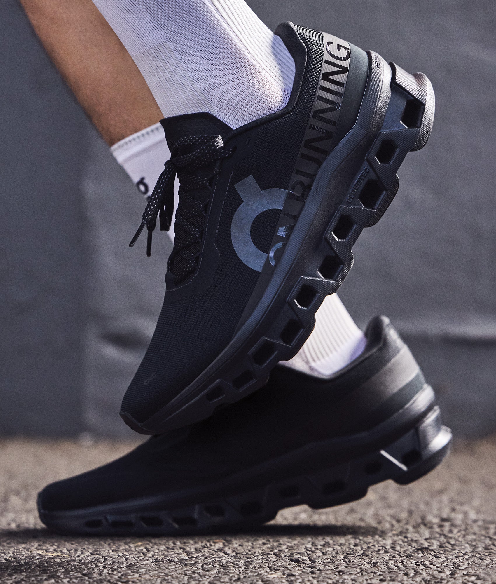 On Cloudmonster 1 Sneakers in Black/Black at EQVVS Menswear. Campaign shot.