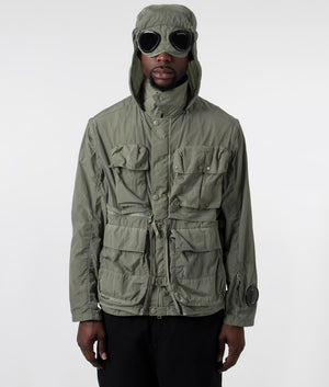 CP Company Chrome-R Goggle Utility Jacket in Agave Green, 100% Polyamide Front Goggle Shot at EQVVS
