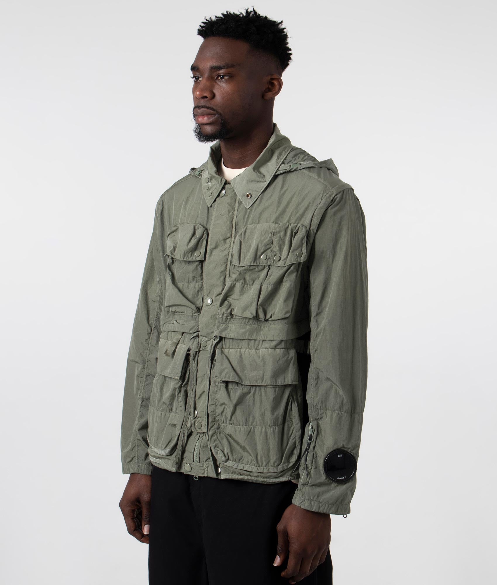 CP Company Chrome-R Goggle Utility Jacket in Agave Green, 100% Polyamide Angle Shot at EQVVS