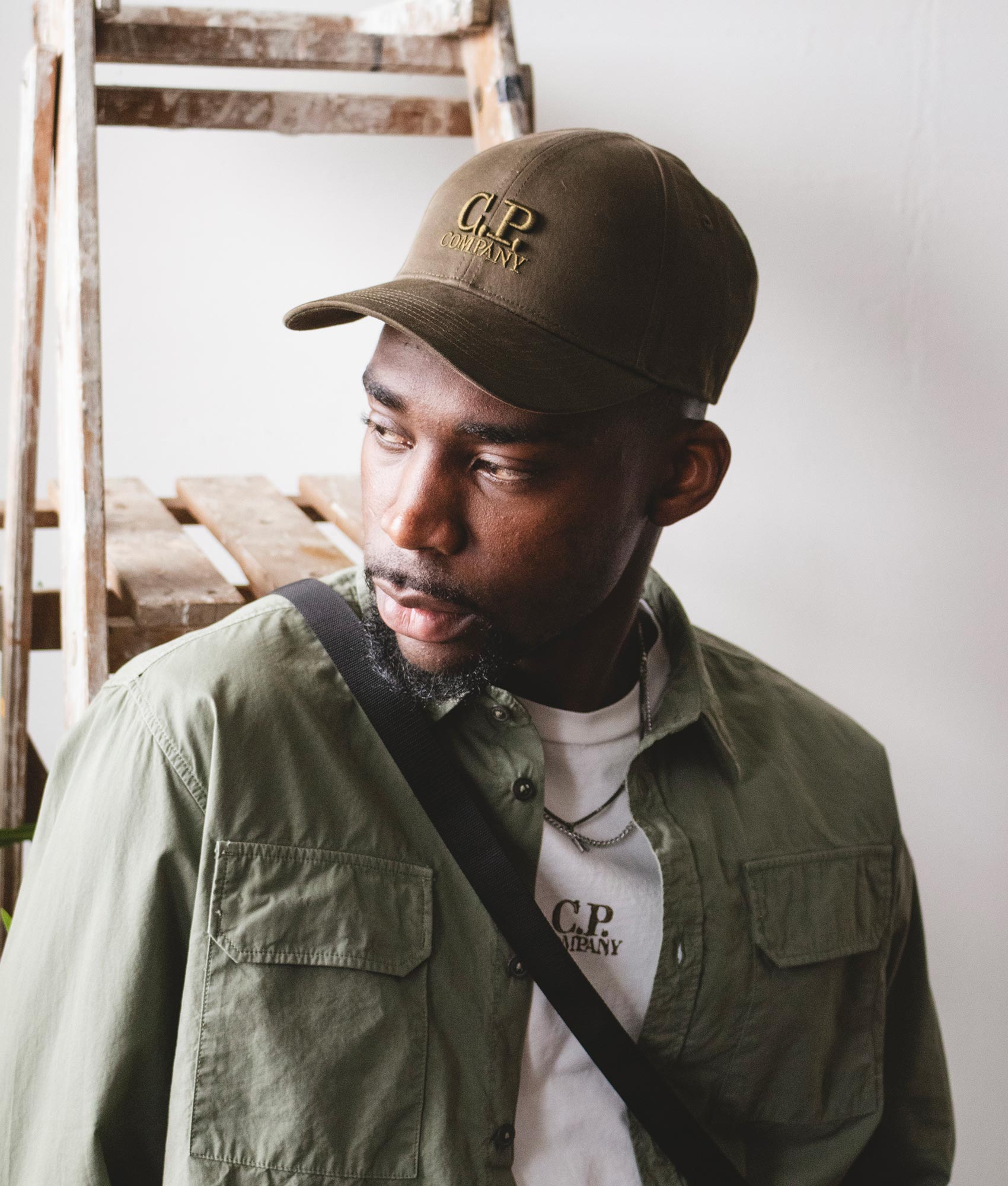 CP Company Gabardine Logo Cap in Ivy Green Campaign Shot at EQVVS