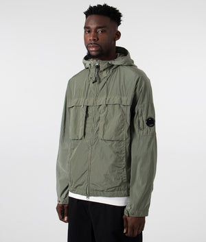 CP Company Chrome-R Hooded Jacket in Agave Green, 100% Polyamide Angle Shot at EQVVS