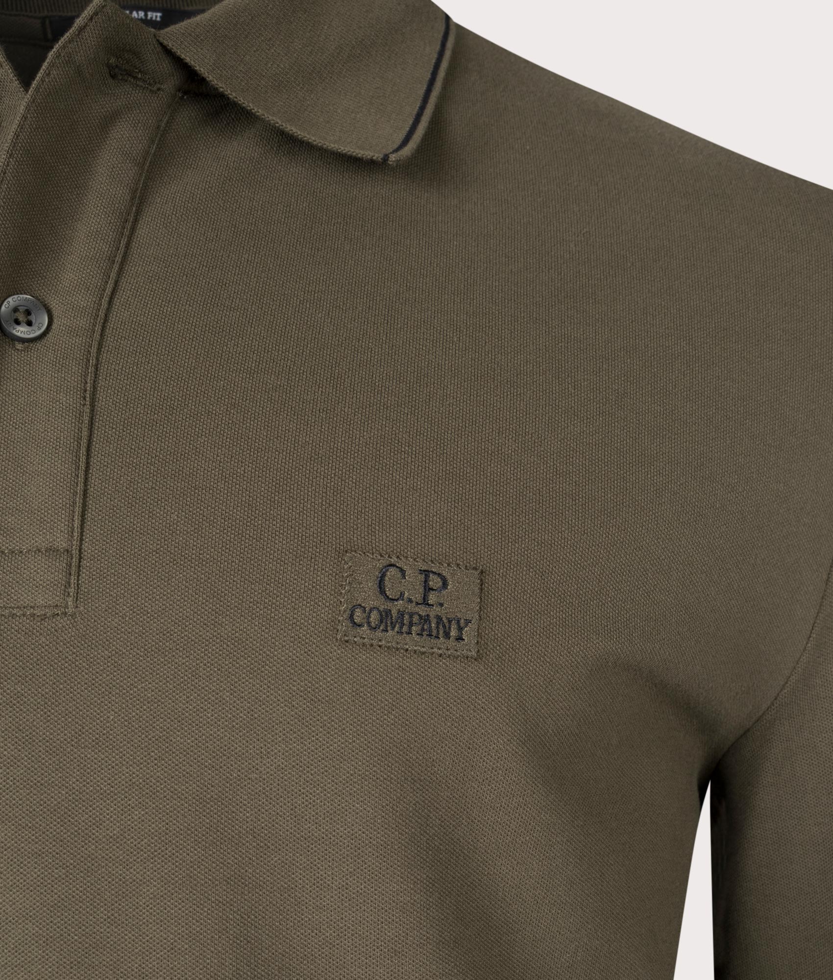 CP Company Stretch Piquet Long Sleeve Polo Shirt in Ivy Green, 100% Cotton  Close Up Shot at EQVVS