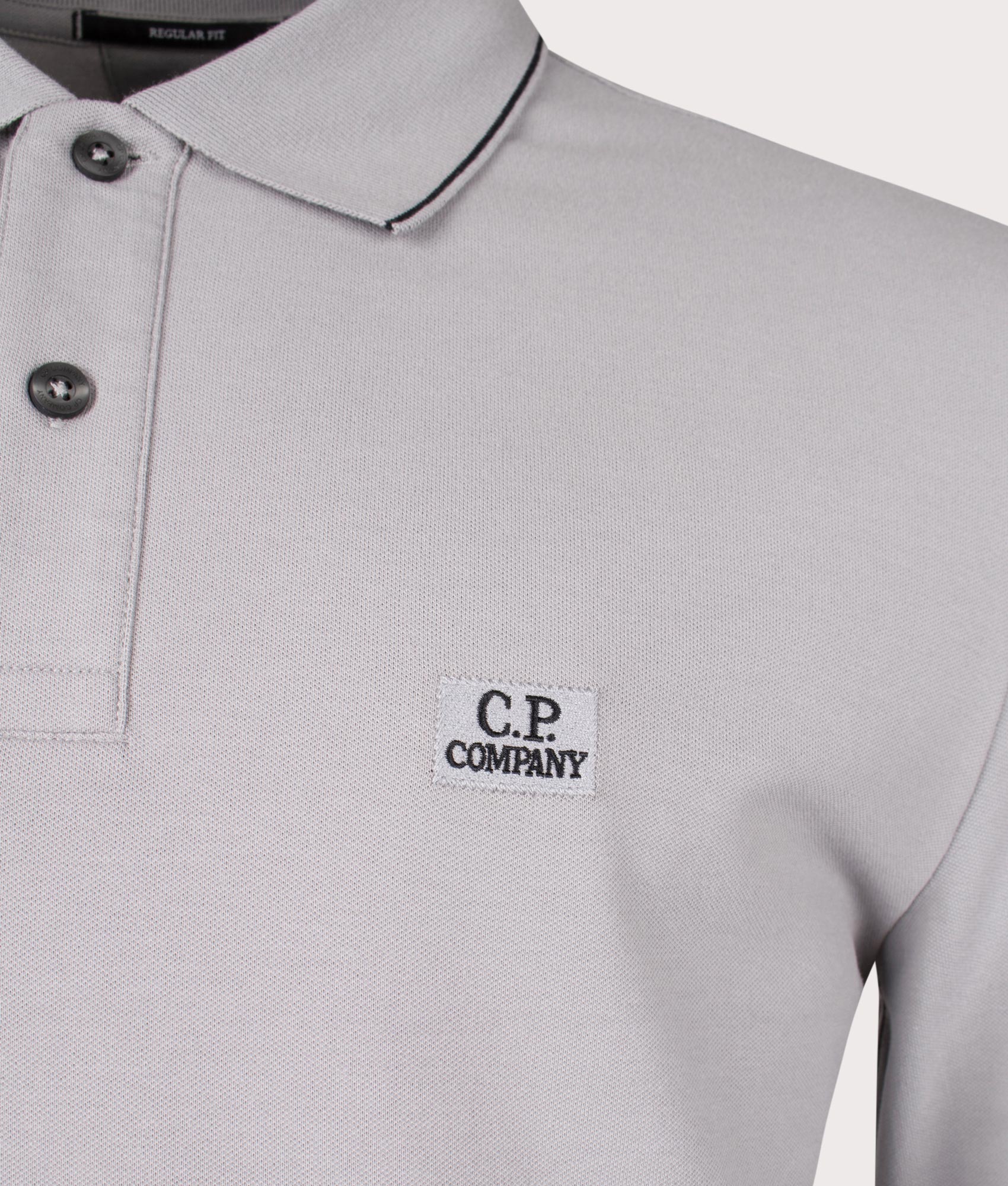 CP Company Stretch Piquet Long Sleeve Polo Shirt in Drizzle Grey Close Up Shot at EQVVS