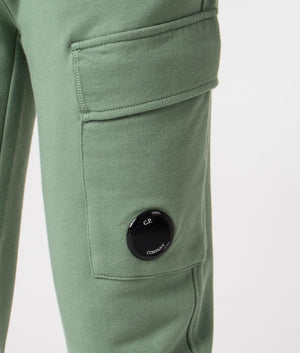 CP Company Diagonal Raised Fleece Cargo Joggers in Green Featuring the CP Company Goggle, 100% Cotton Detail Shot at EQVVS