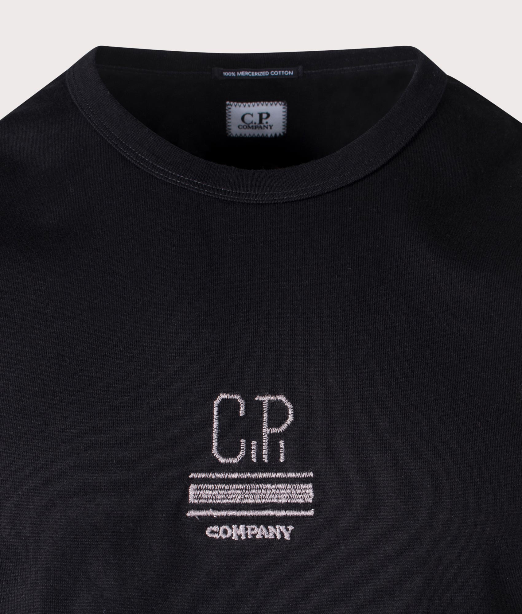 C.P. Company Mercerized Jersey T-Shirt in black. Shot at EQVVS. Detail shot. 