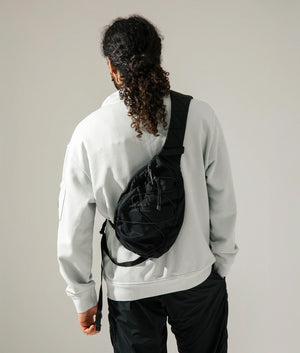 Nylon B Crossbody Rucksack. Shot by EQVVS. Model shot.