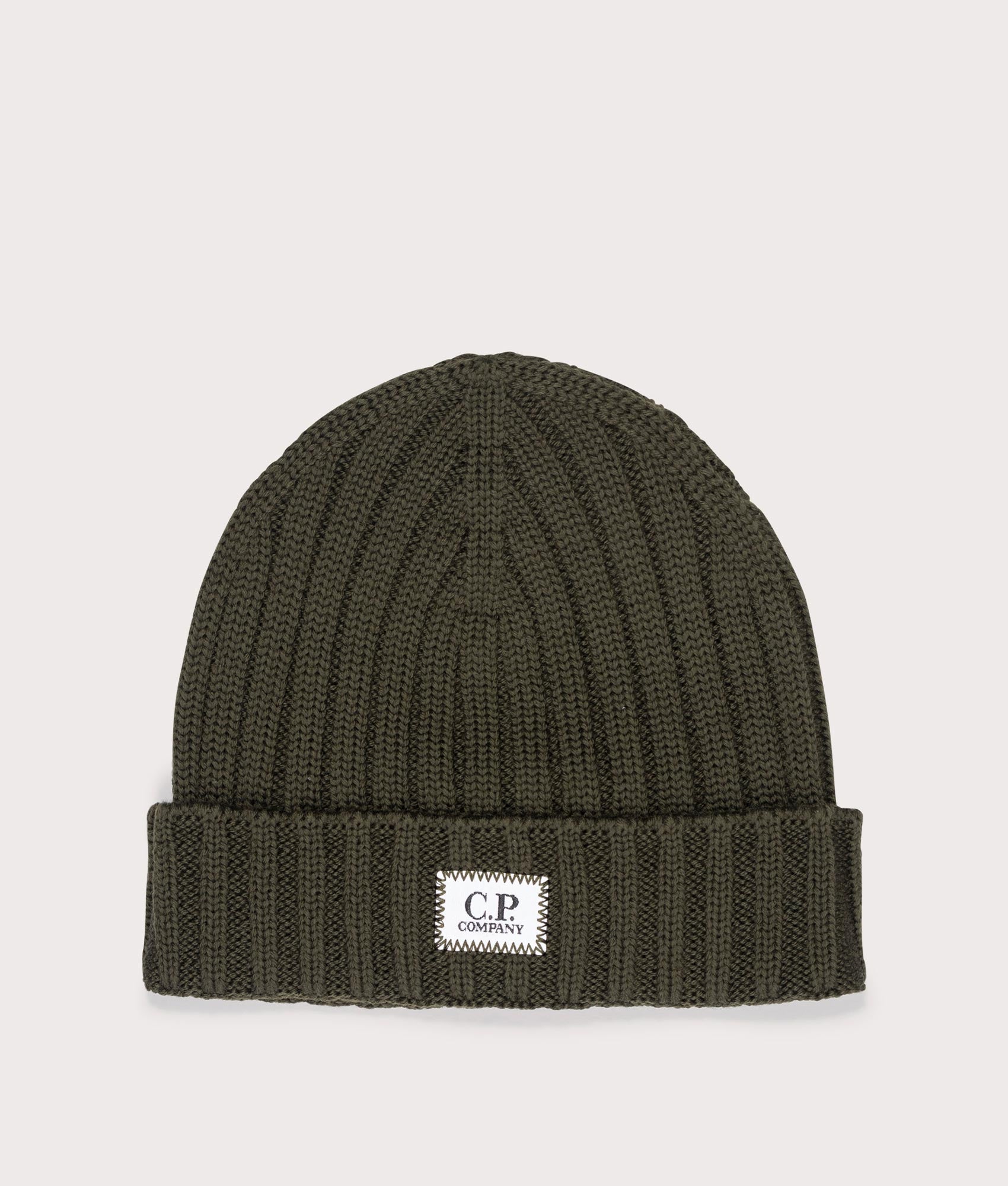 Extra Fine Merino Wool Logo Beanie in Ivy Green by C.P. Company. EQVVS Shot. 
