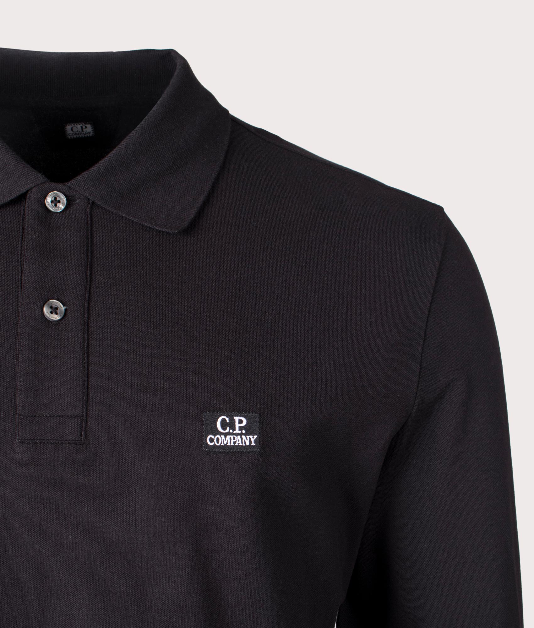 Stretch Piquet Long Sleeve Polo Shirt in Black by C.P. Company. EQVVS Shot.