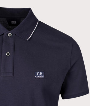 Stretch Piquet Short Sleeve Polo Shirt in Total Eclipse by C.P. Company. EQVVS Shot.