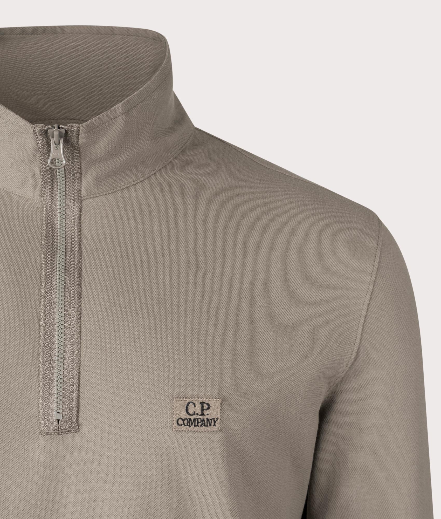 Stretch Piquet Long Sleeve Quarter Zip Polo Shirt in Walnut by C.P. Company. EQVVS Shot.