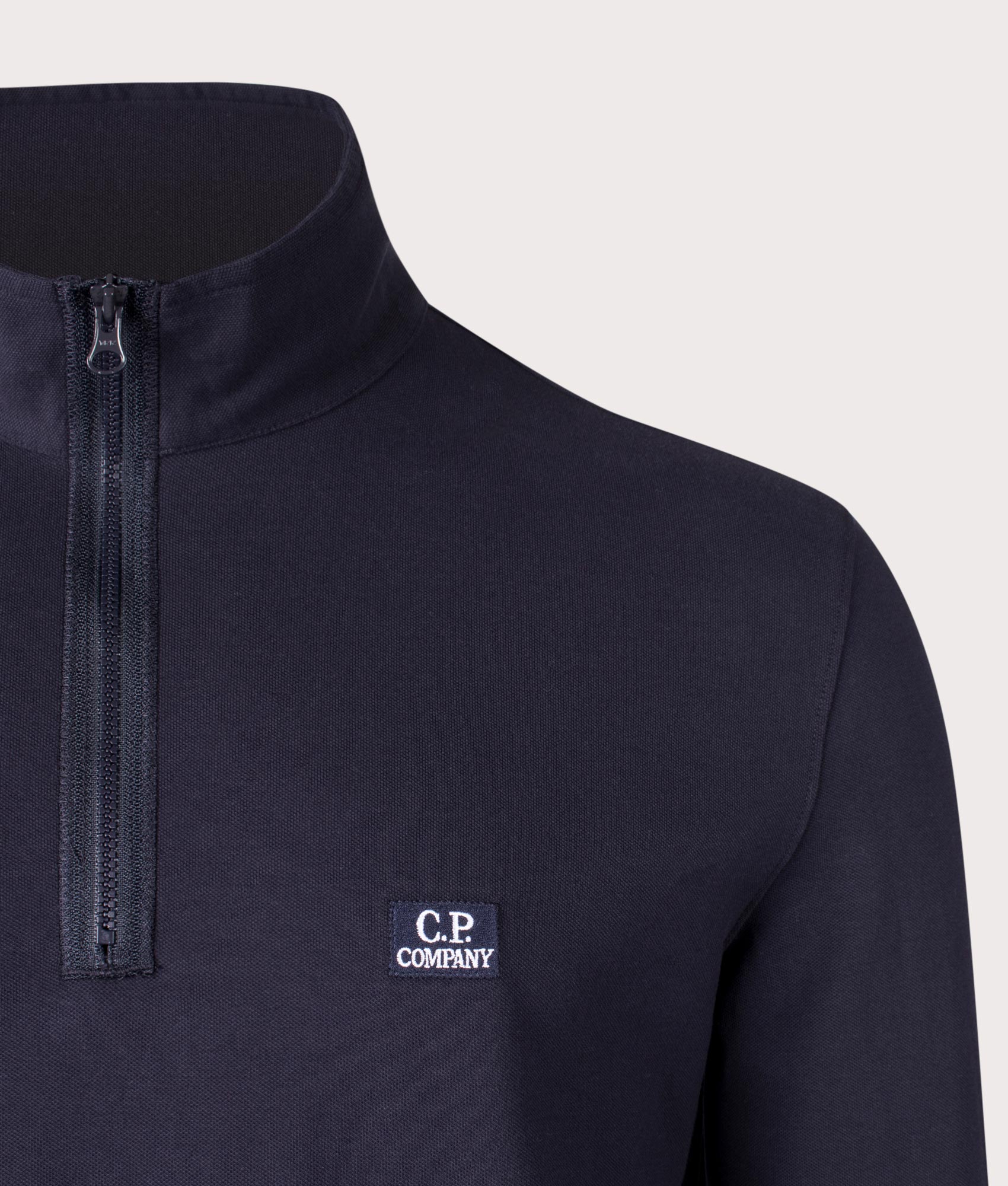 Stretch Piquet Long Sleeve Quarter Zip Polo Shirt in Total Eclipse by C.P. Company. EQVVS Shot.