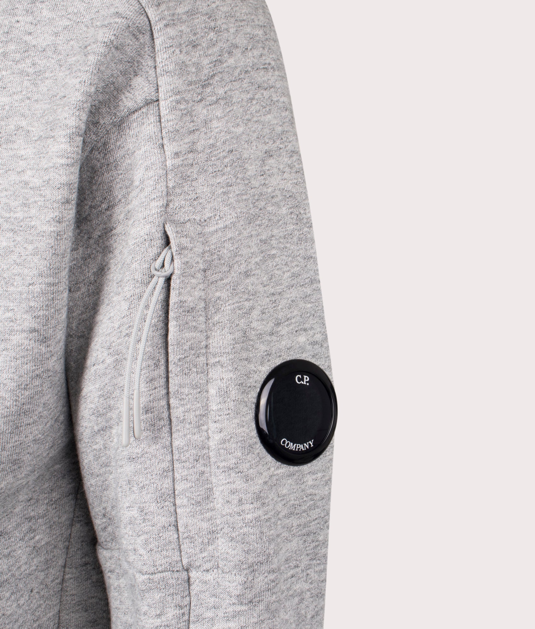 Diagonal Raised Fleece Zip Through Hoodie in Greystone Melange by C.P. Company. EQVVS Shot.
