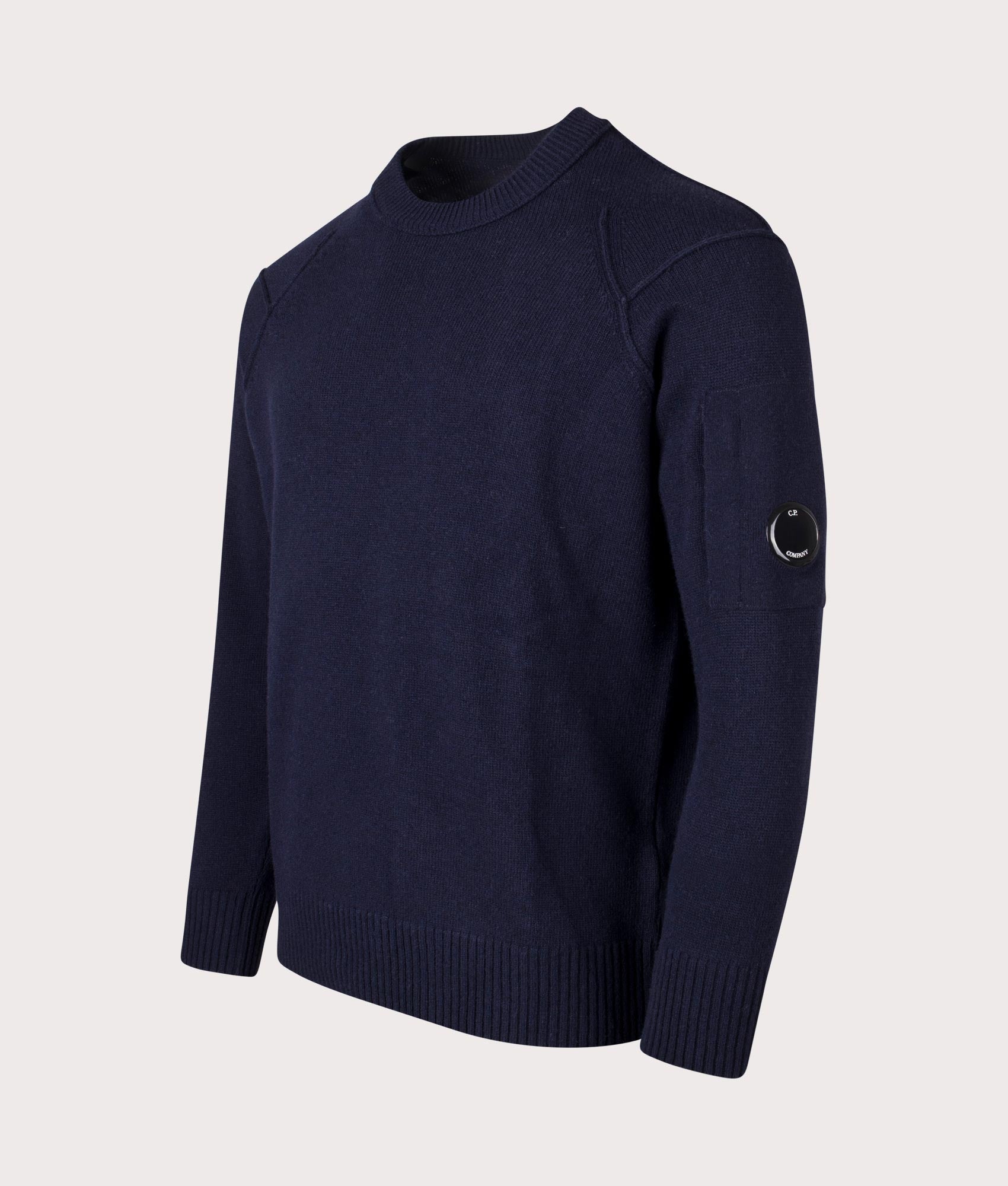 Lambswool Knitted Jumper in Total Eclipse by C.P. Company. shot at EQVVS. Angle shot.  