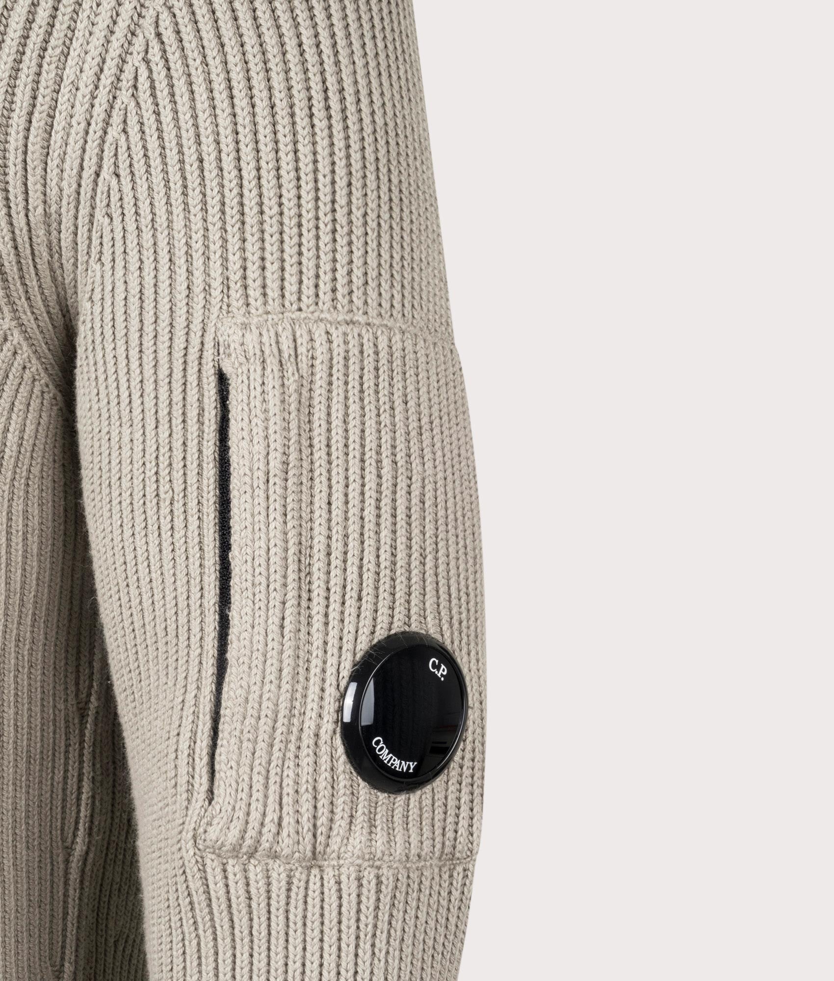 CP Company Full Rib Quarter Zip Knitted Jumper in 327 Vintage Khaki. At EQVVS Menswear. Lens shot