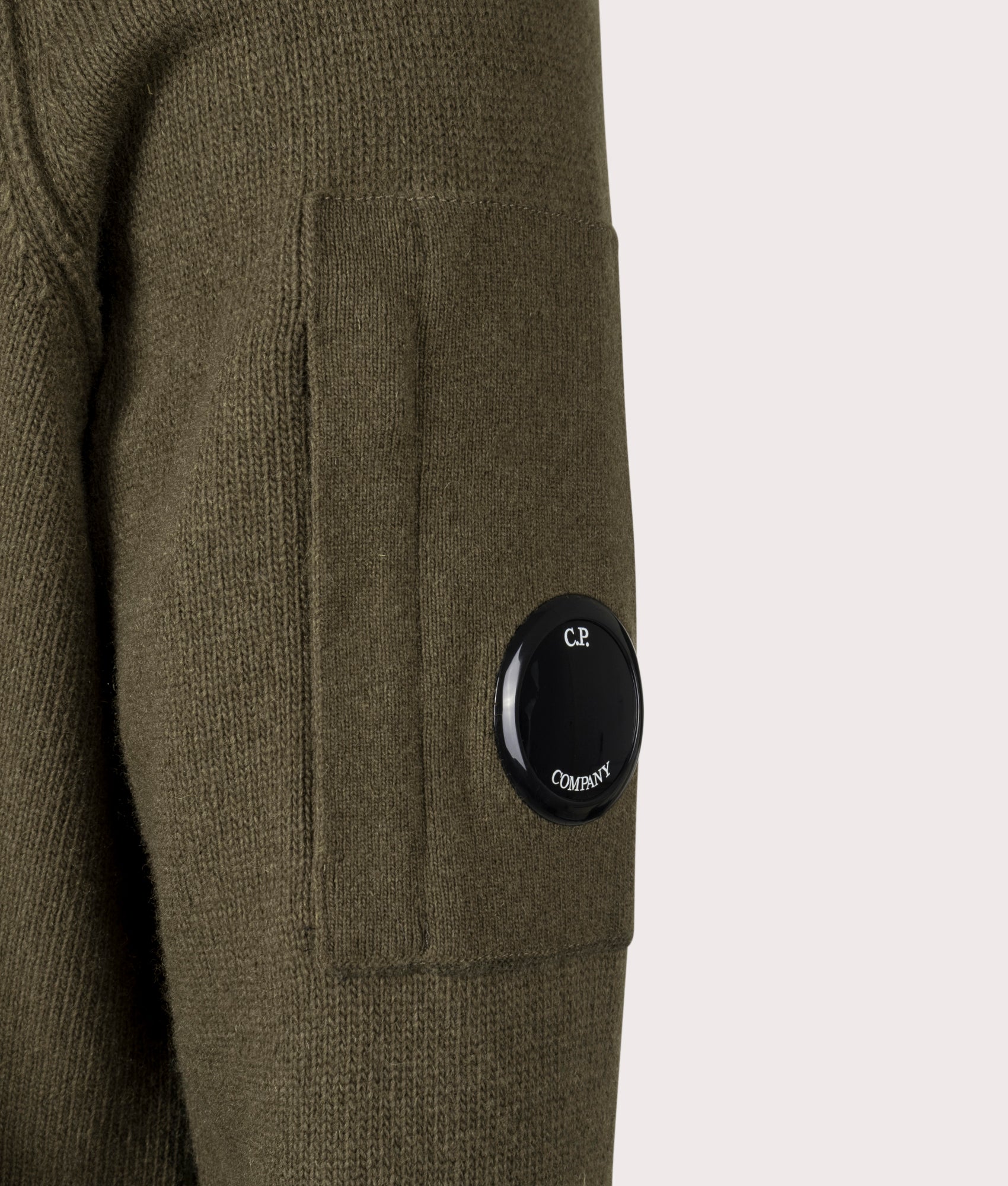 Ivy Green Lambswool Quarter Zip Jumper by C.P. Company. Shot at EQVVS. Detail shot.