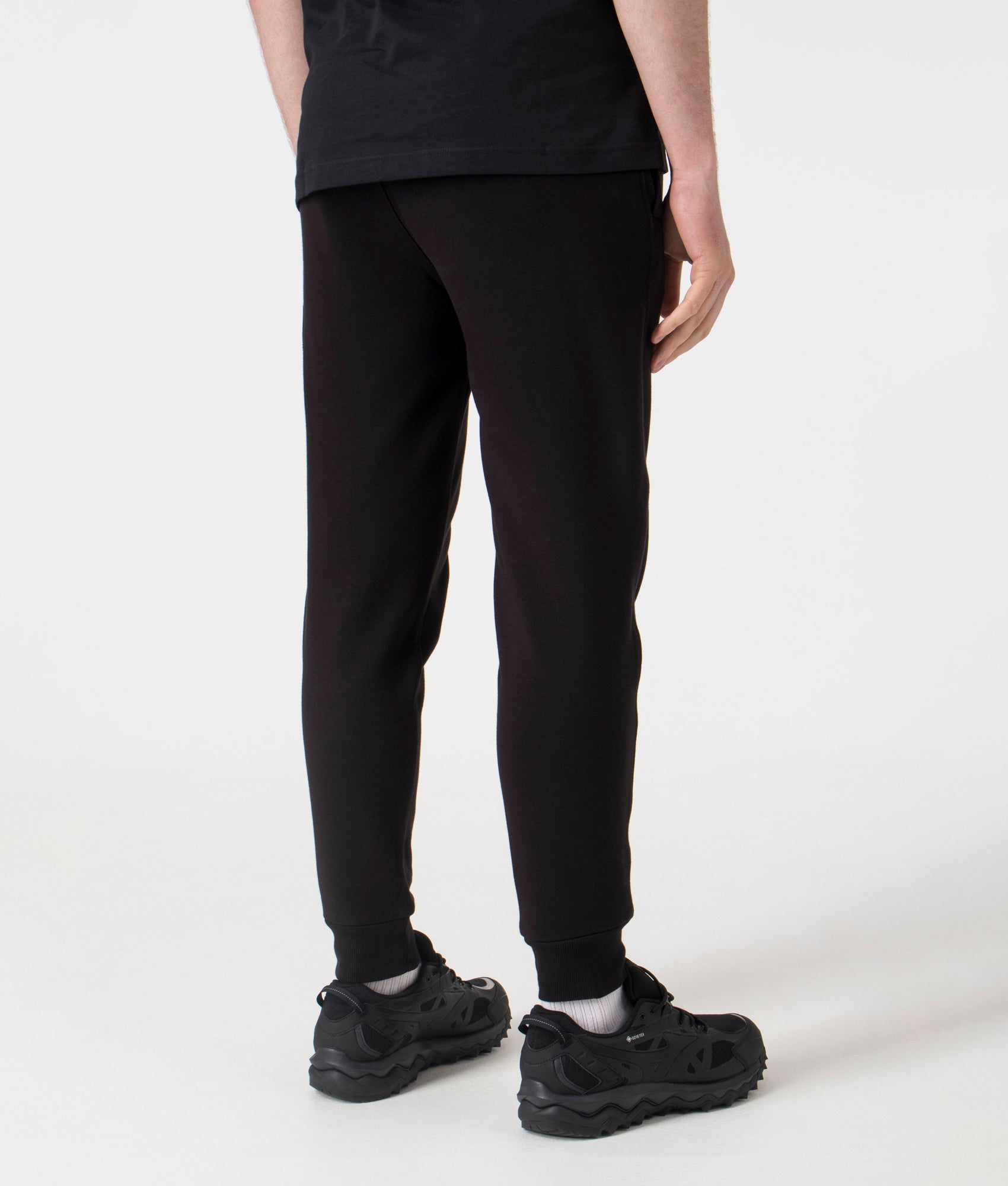 C.P. Company  Diagonal Raised Lens Joggers in Black. Shot at EQVVS. Back shot 
