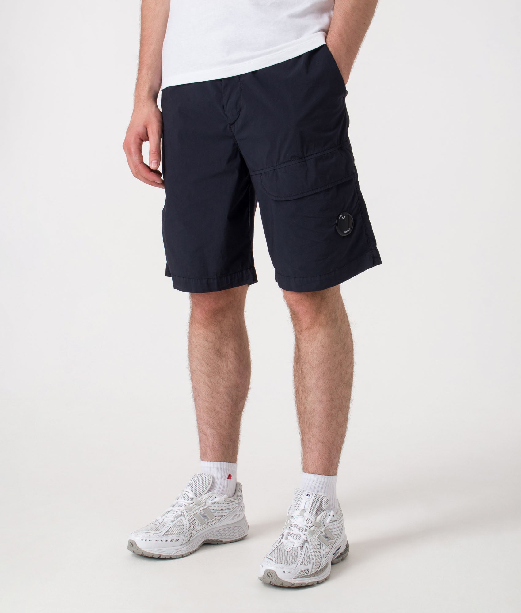 Bermuda Cargo Shorts. Shot by EQVVS. Front detail model shot.