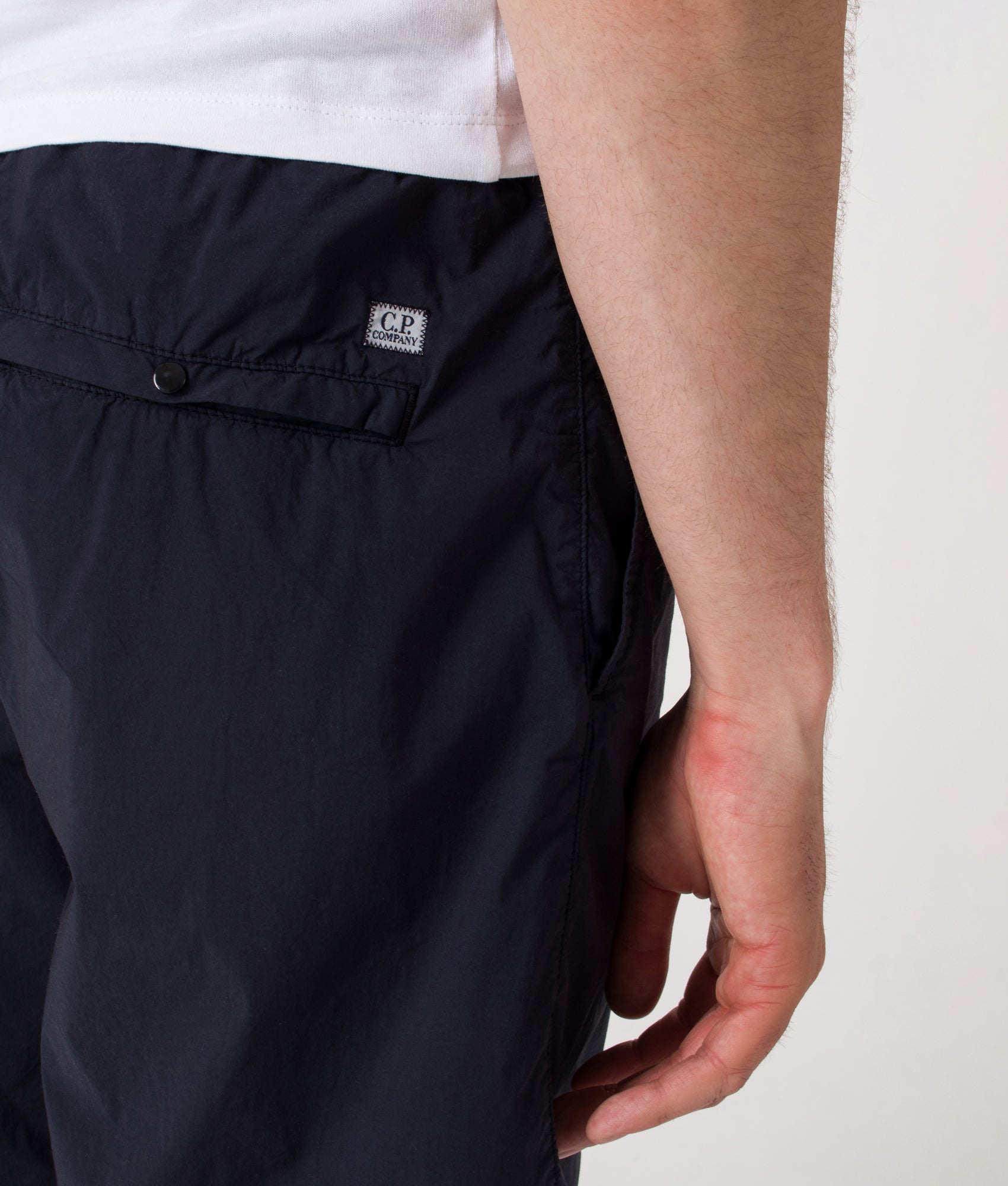 Bermuda Cargo Shorts. Shot by EQVVS. Back detail model shot.