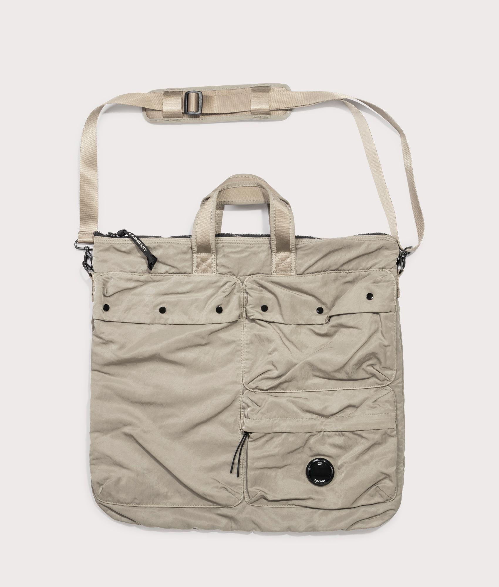 C.P. Company Nylon B Crossbody Rucksack in Fallen Rock at EQVVS Menswear. Front shot.