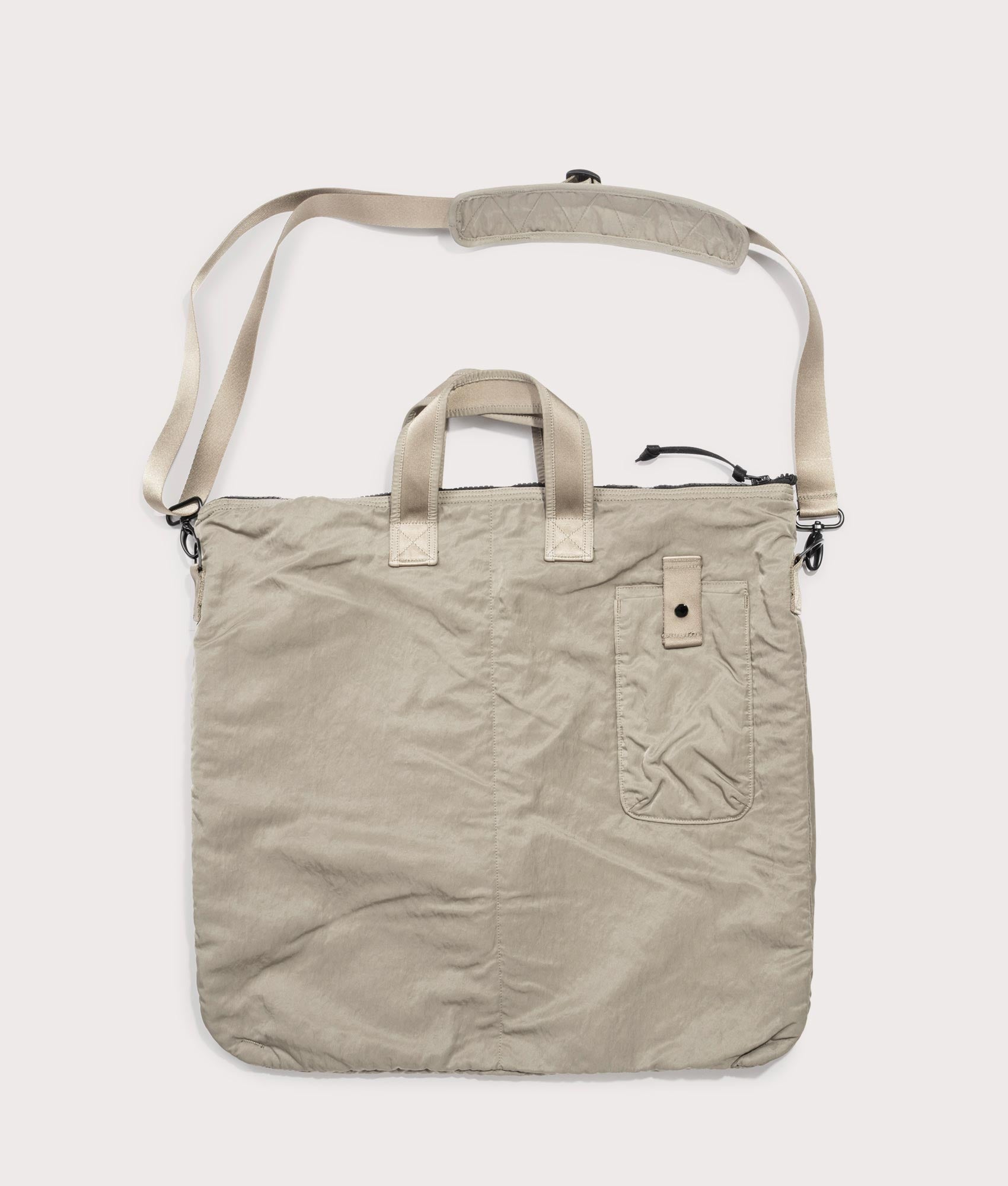 C.P. Company Nylon B Crossbody Rucksack in Fallen Rock at EQVVS Menswear. Back shot.