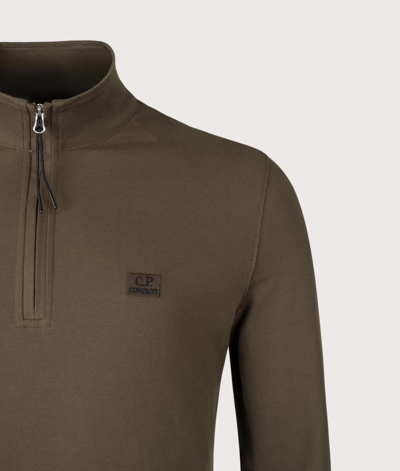 Stretch Piqué Quarter Zip Long Sleeve Polo Shirt. Shot by EQVVS. Detail shot.