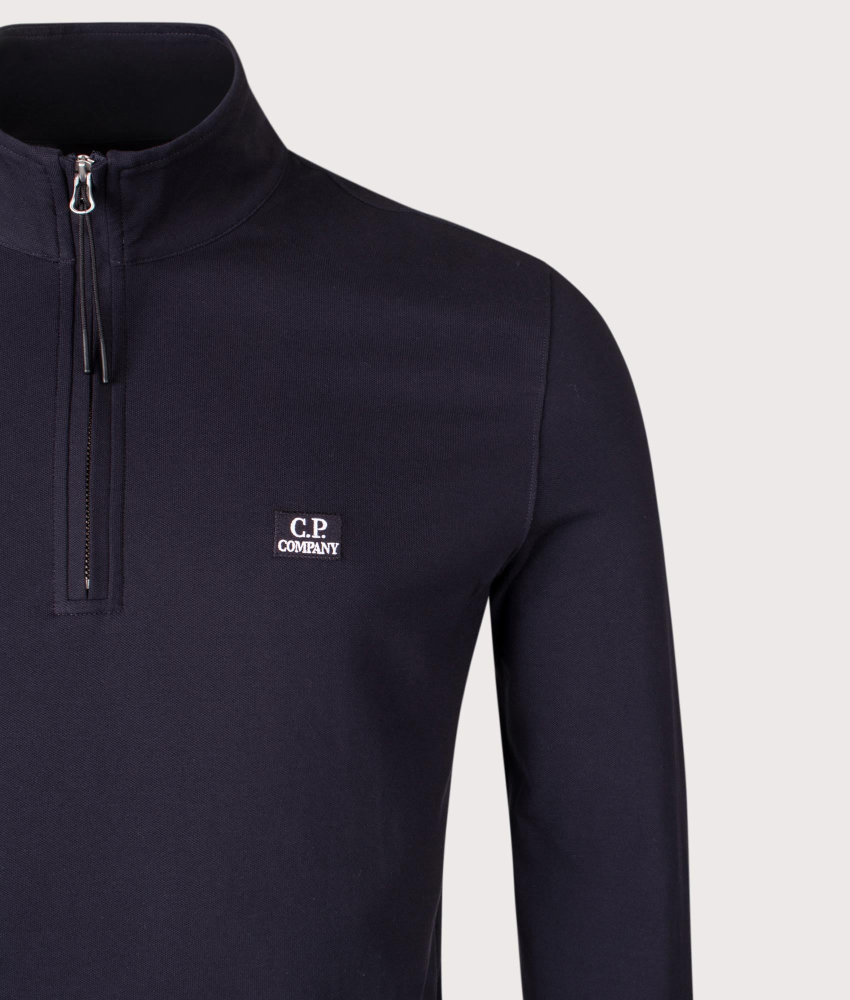 Stretch Piqué Quarter Zip Long Sleeve Polo Shirt. Shot by EQVVS. Detail shot.