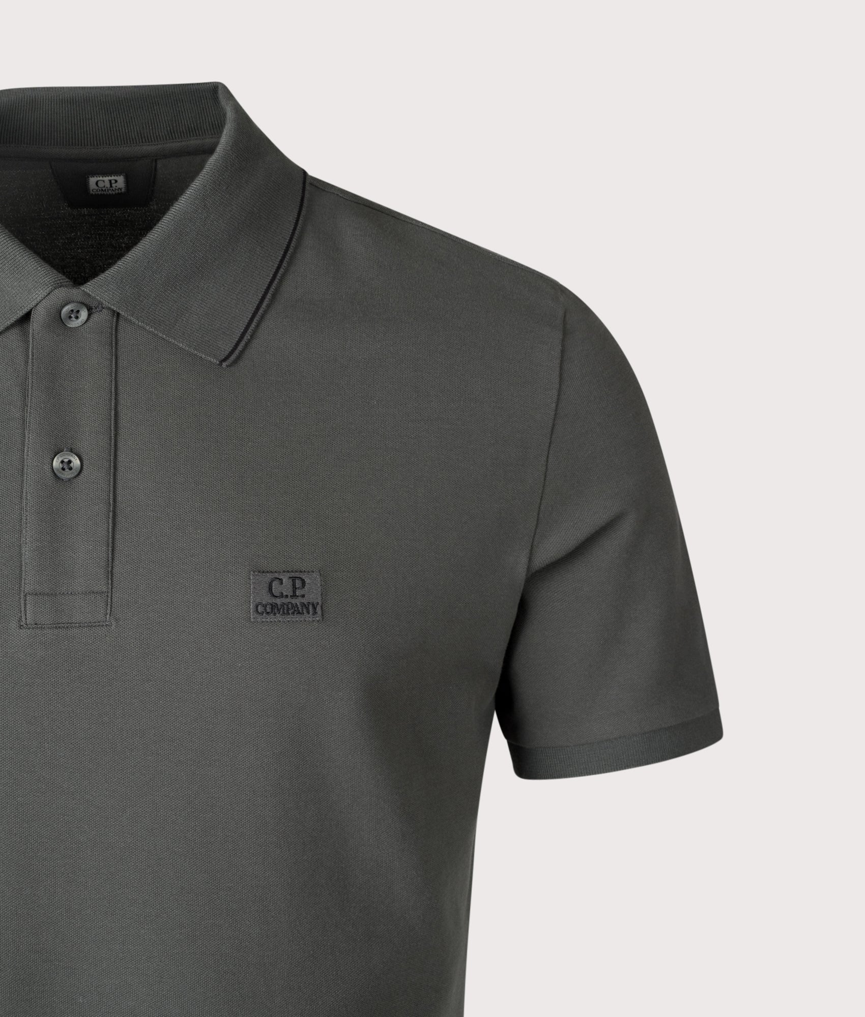 Stretch Piqué Striped Collar Polo Shirt by C.P. Company in Dark Shadow. Shot by EQVVS. Detail Shot.