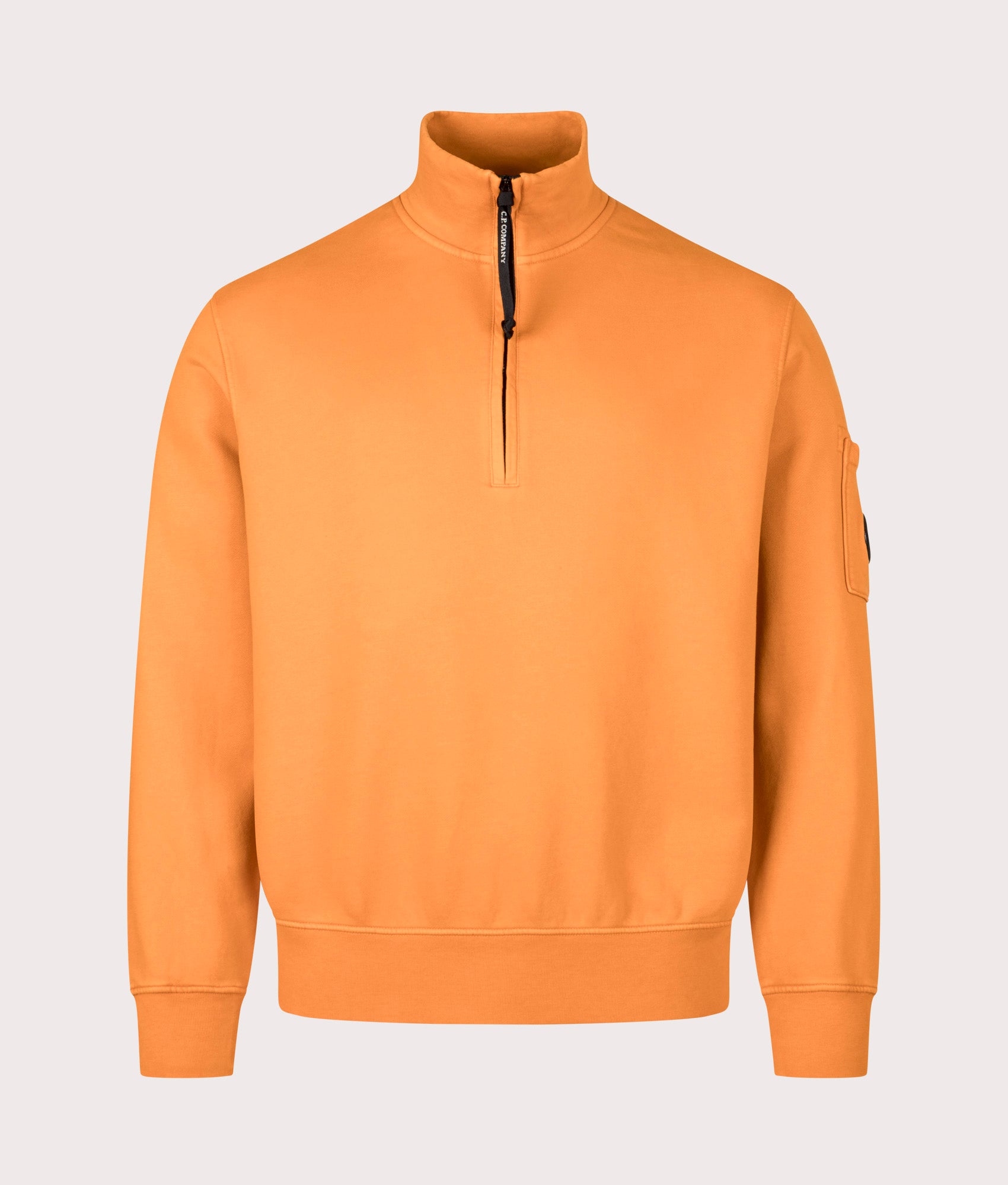 C.P. Company Diagonal Fleece Quarter Zip Sweatshirt in Russet Orange at EQVVS Menswear. Front shot.