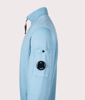 C.P. Company Diagonal Fleece Quarter Zip Sweatshirt in Aegean Blue at EQVVS Menswear. Side detail shot.