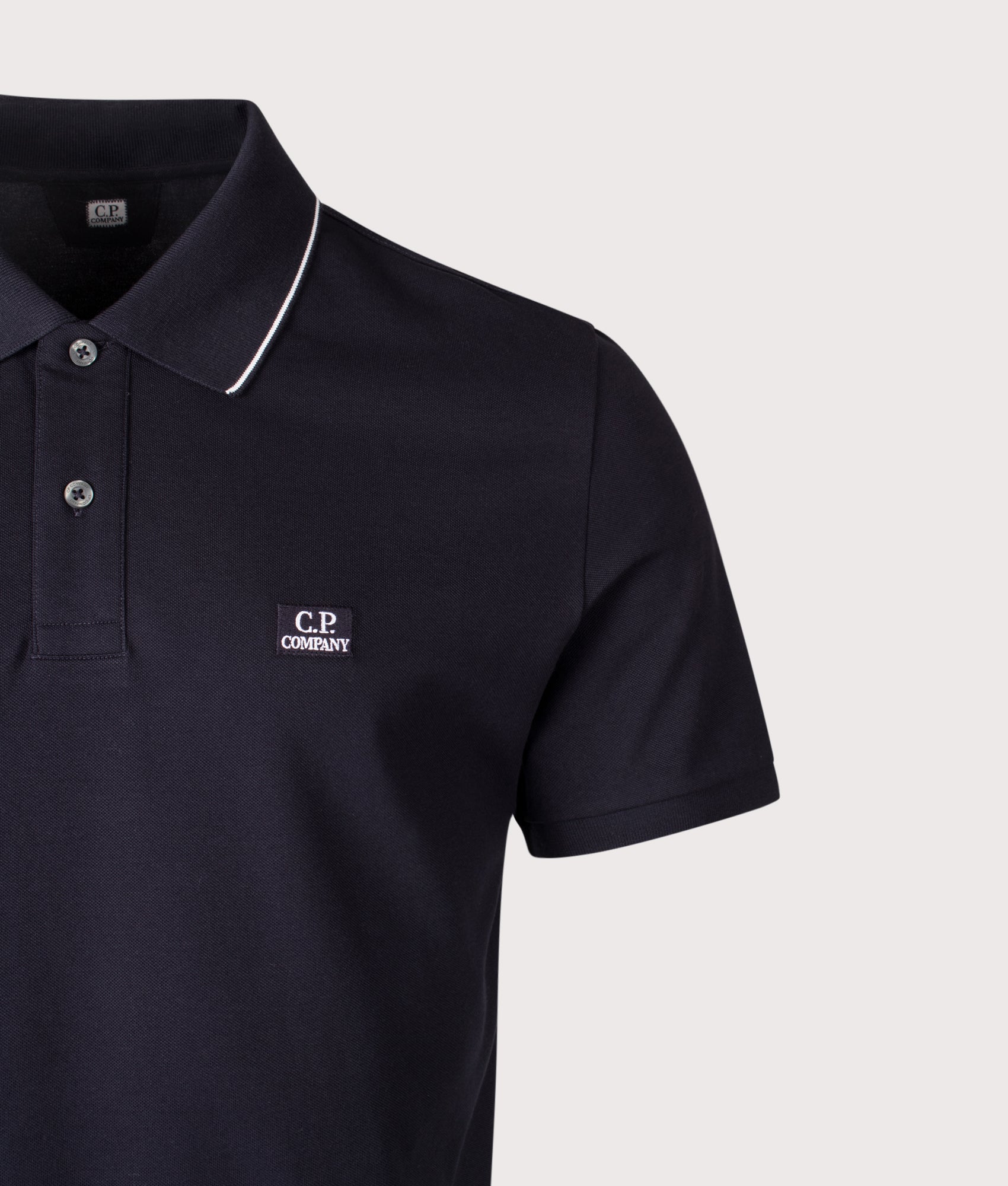 Stretch Piquet Logo Polo Shirt in Total Eclipse | C.P. Company | EQVVS | Front detail shot 
