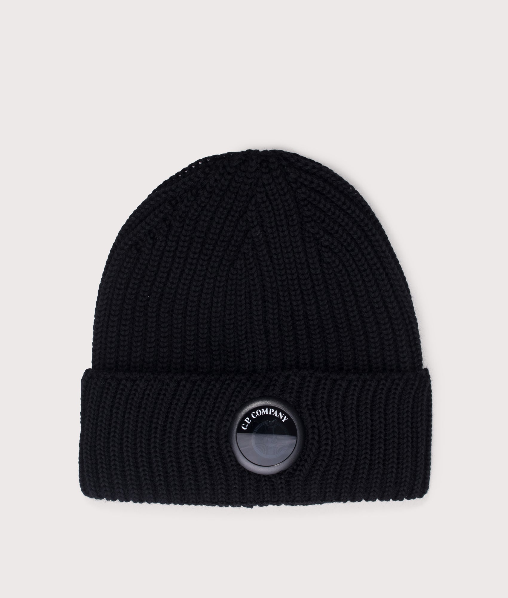 C.P. Company Extrafine Merino Wool Lens Beanie in Black at EQVVS Menswear. Front shot.