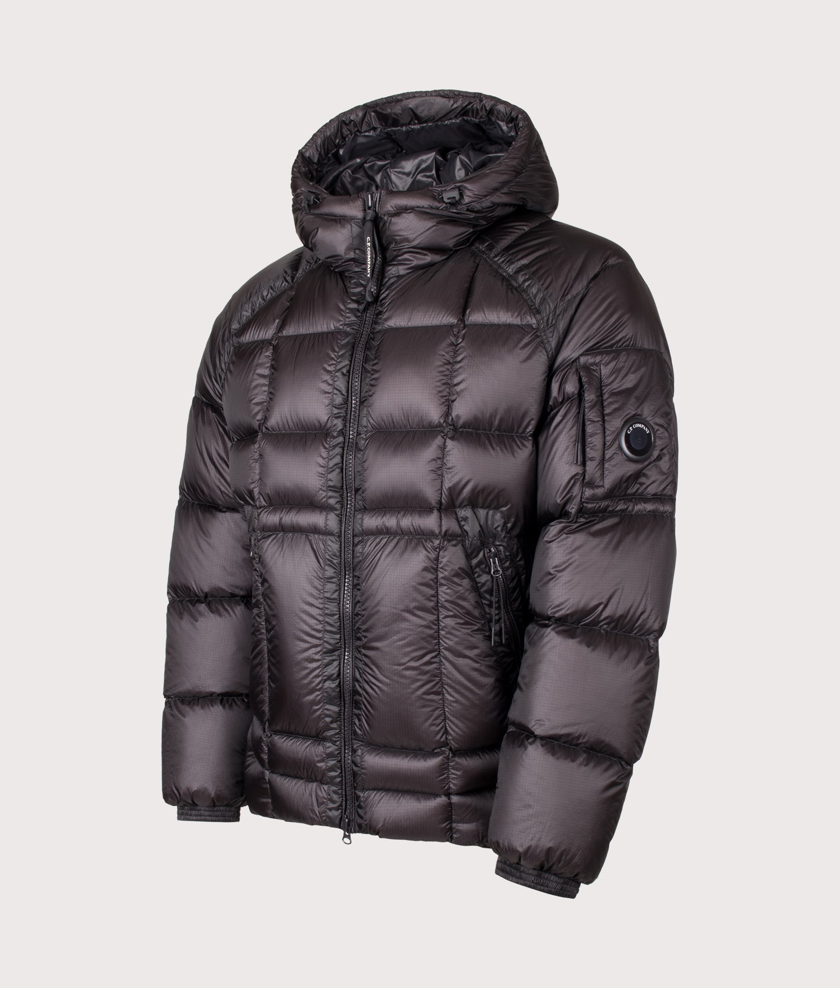 C.P. Company D.D. Shell Hooded Down Jacket in Black at EQVVS Menswear. Angled front shot.