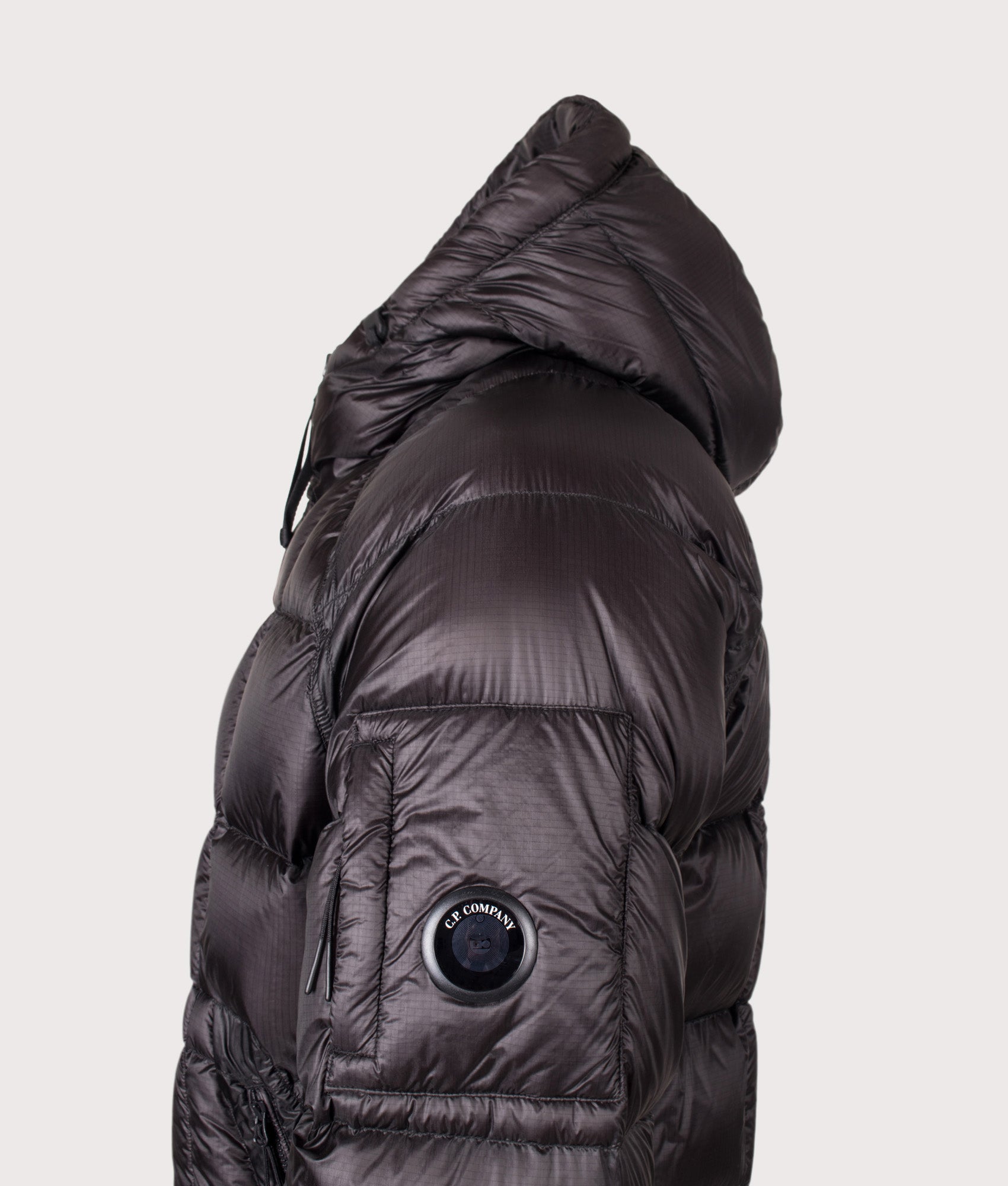 C.P. Company D.D. Shell Hooded Down Jacket in Black at EQVVS Menswear. Detail shot.
