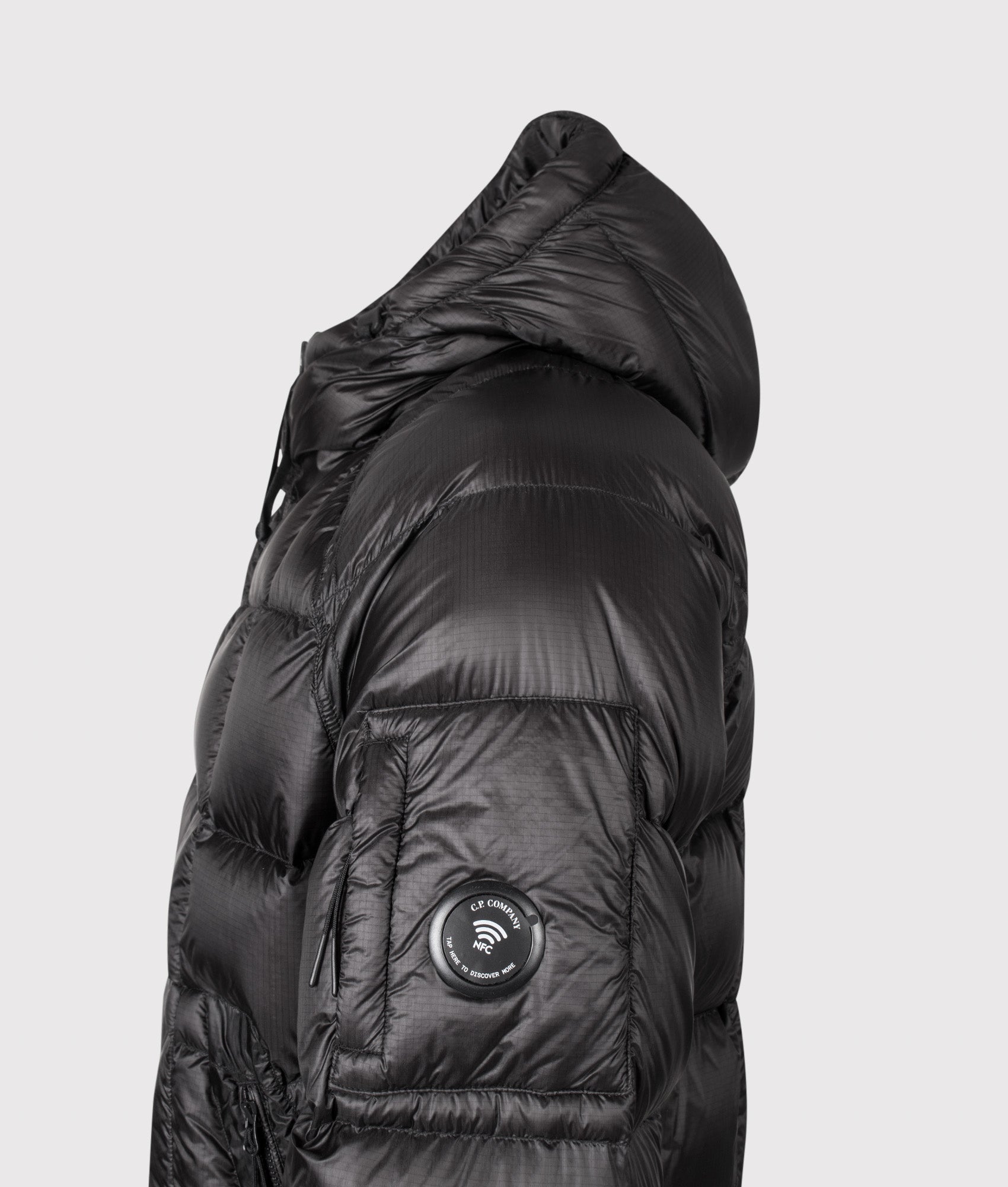 C.P. Company D.D. Shell Hooded Down Jacket in Black at EQVVS Menswear. NFC Detail shot.