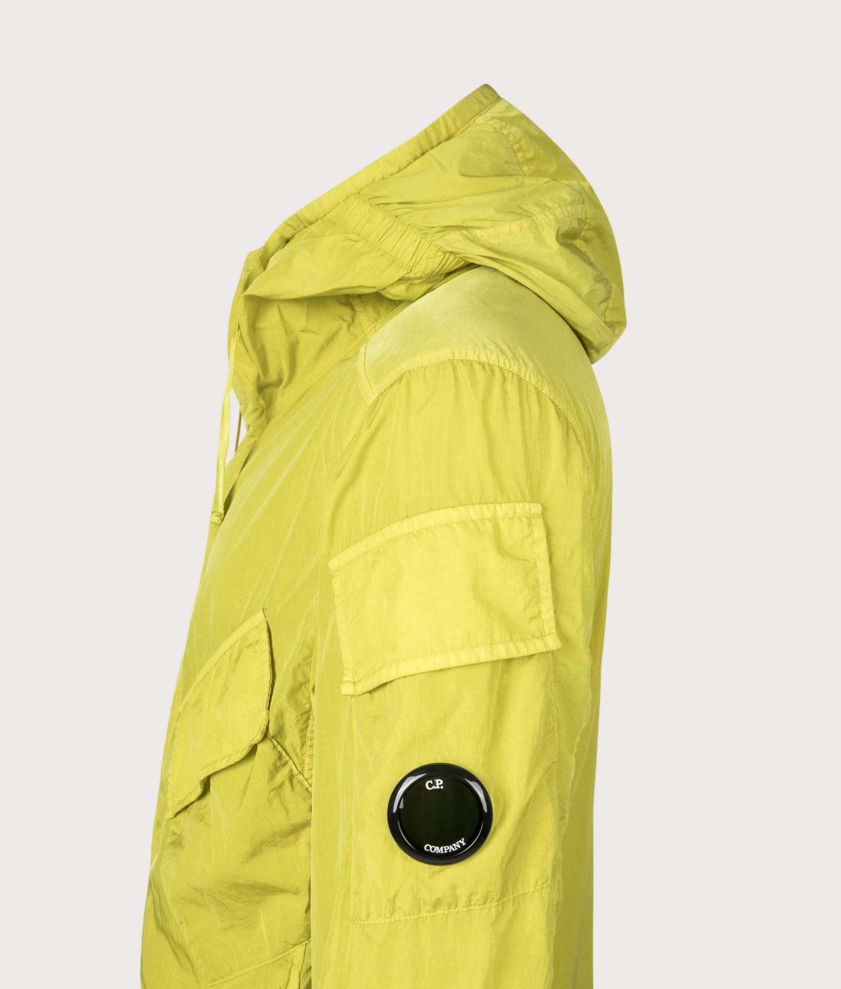 C.P. Company Chrome-R Hooded Lens Overshirt in Antique Moss at EQVVS Menswear. Side detail shot.