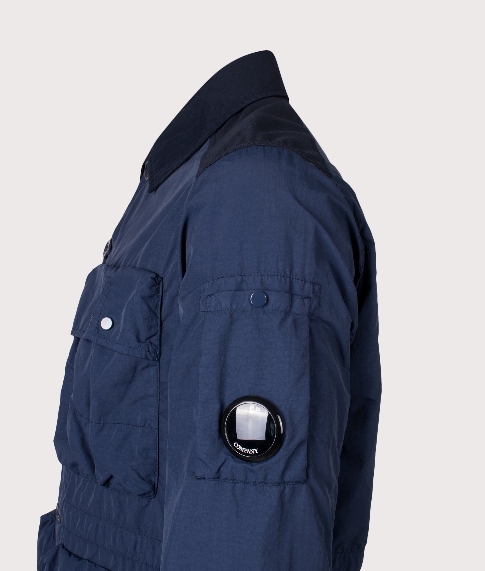C.P. Company Flatt Nylon Mixed Button Lens Jacket in Midnight Navy at EQVVS Menswear. Lens detail shot.
