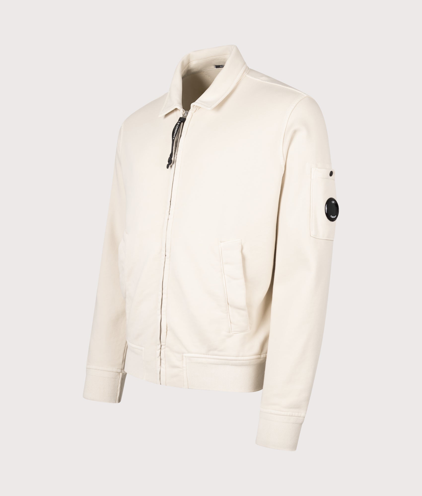 C.P. Company Diagonal Fleece Zip Lens Sweatshirt in Frozen Dew at EQVVS Menswear. Angled front shot.