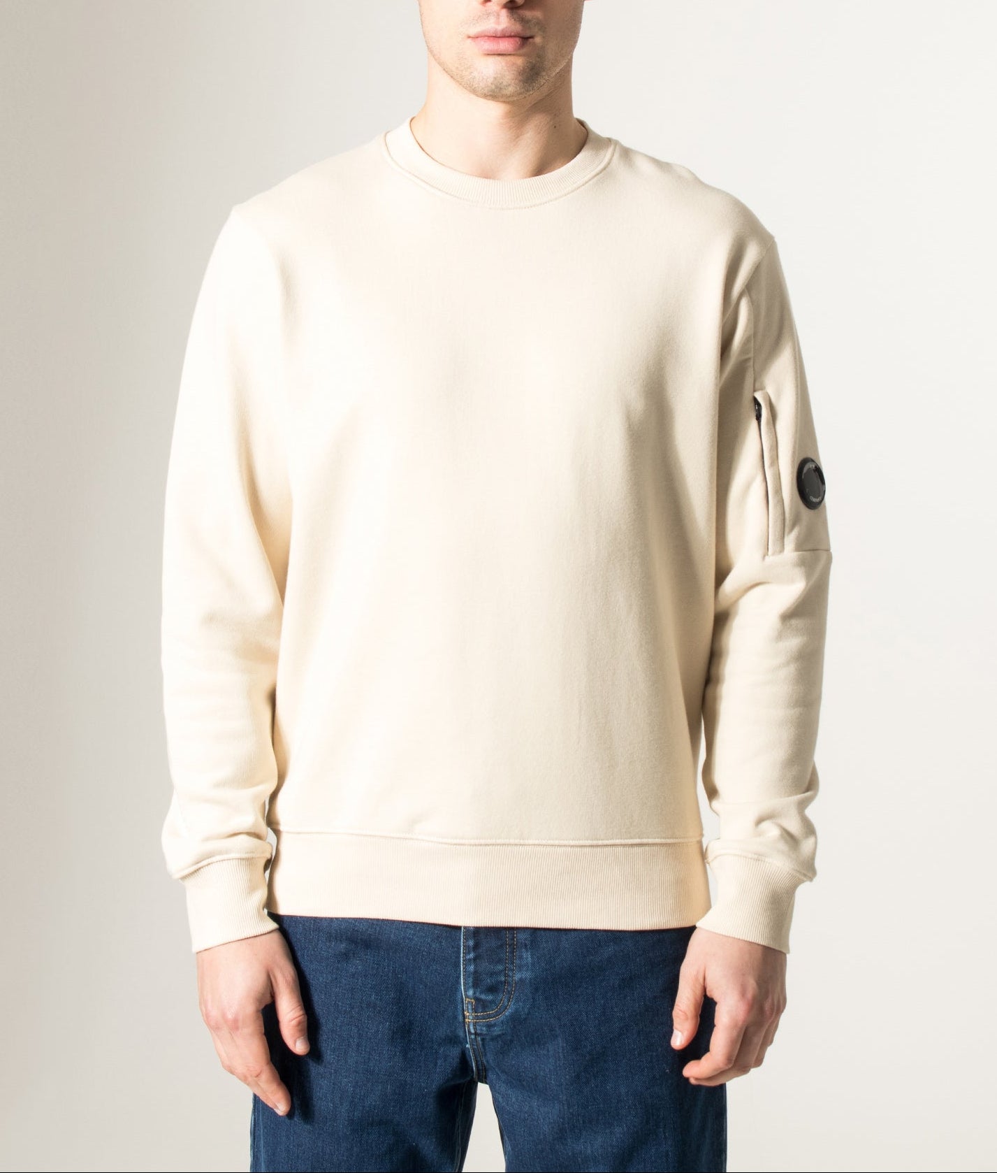 C.P. Company Diagonal Raised Fleece Lens Sweatshirt in Frozen Dew at EQVVS Menswear. Model front shot.