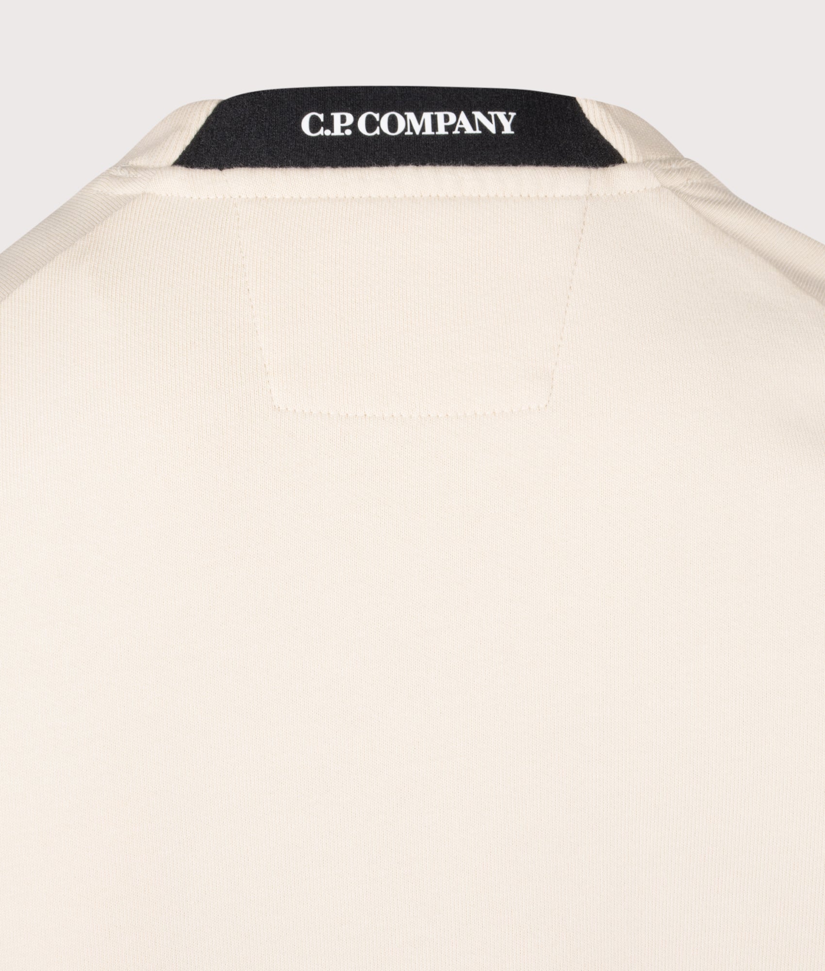 C.P. Company Diagonal Raised Fleece Lens Sweatshirt in Frozen Dew at EQVVS Menswear. Back detail shot.