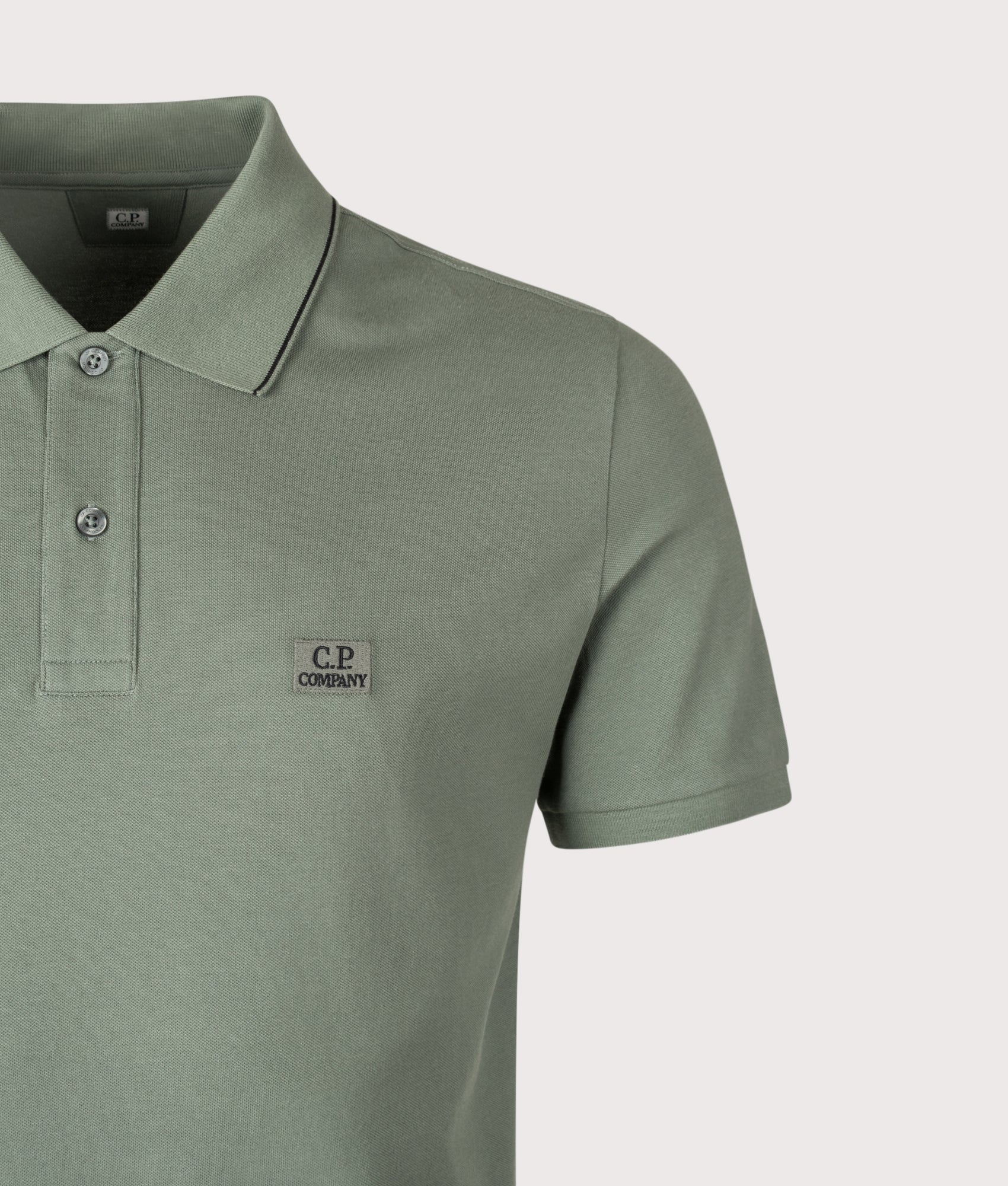 Stretch Piqué Logo Polo Shirt in Laurel Wreath | C.P. Company | EQVVS | Front detail shot 
