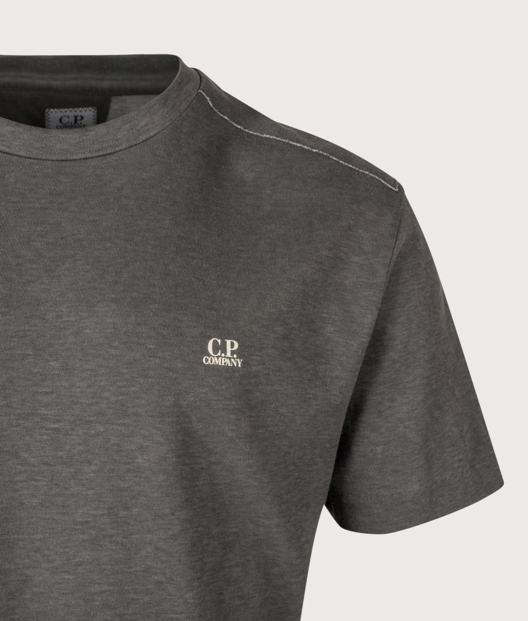C.P. Company 20/1 Jersey Plated Logo T-Shirt in Gunmetal at EQVVS Menswear. Detail shot.