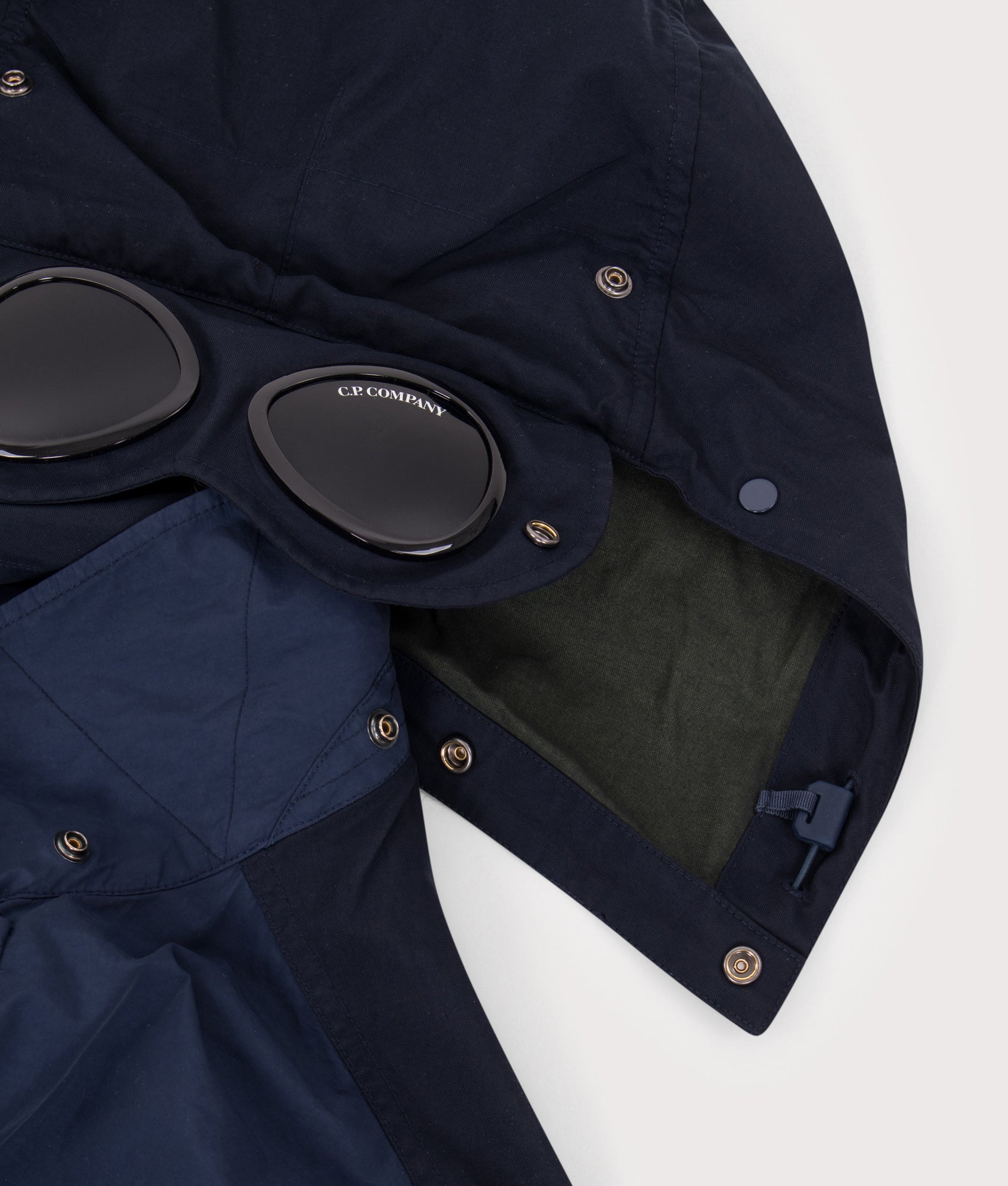 C.P. Company Flatt Nylon Mixed Goggle Overshirt in Midnight Navy at EQVVS Menswear. Hood detail shot.
