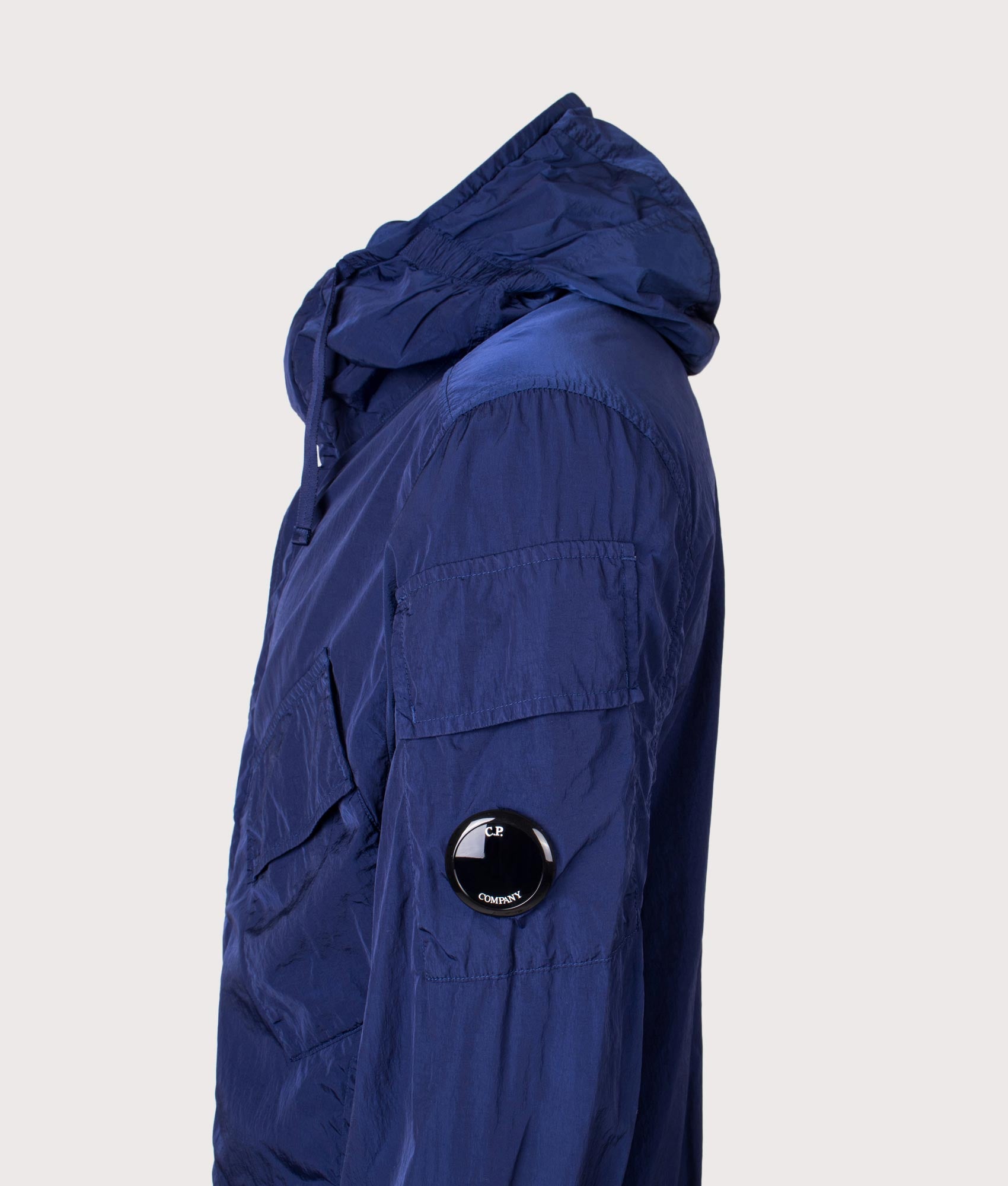 C.P. Company Chrome-R Hooded Lens Overshirt in Blueprint at EQVVS Menswear. Side detail shot.