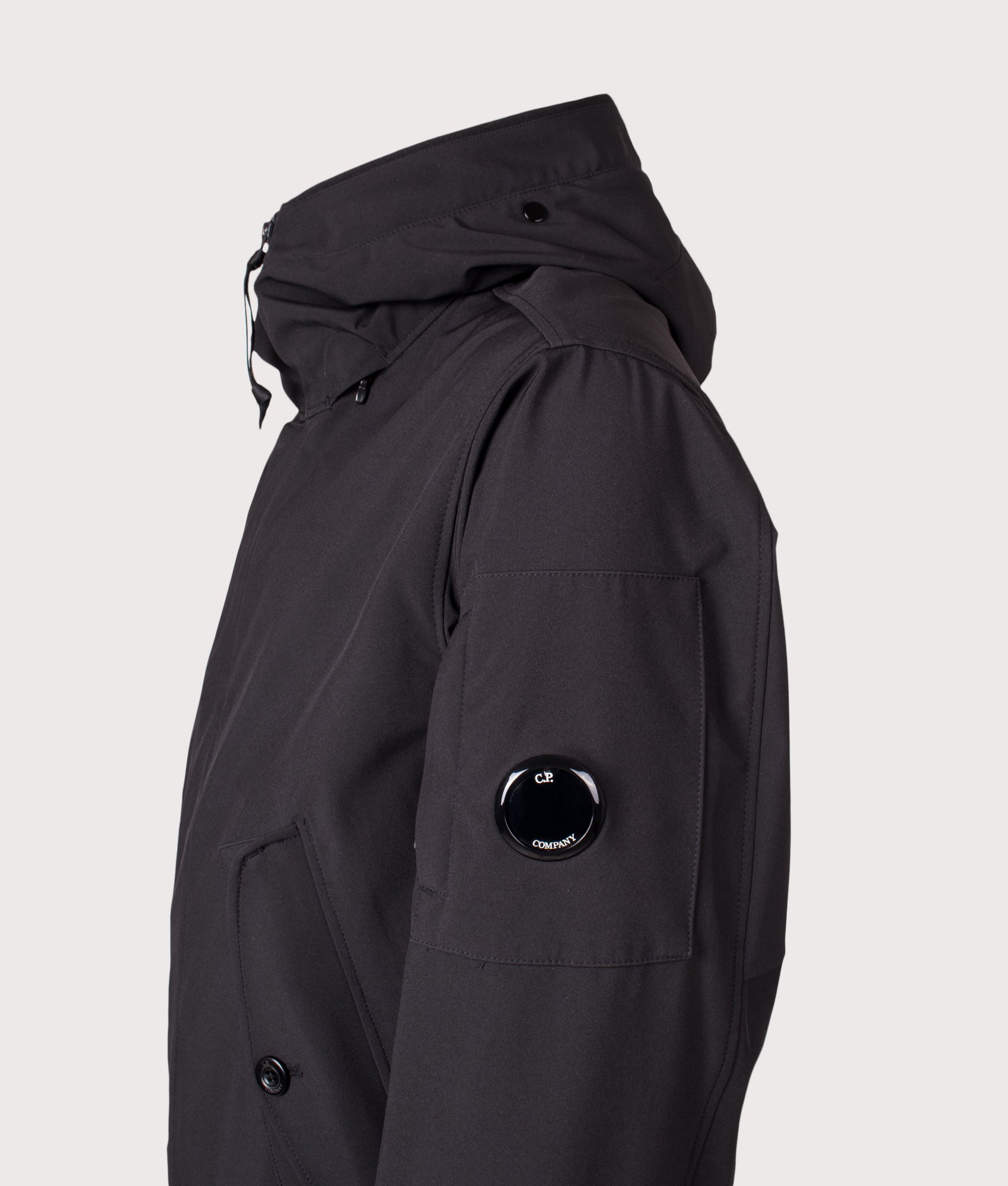 C.P. Company Shell-R Goggle Jacket in Black at EQVVS Menswear. Side detail shot.