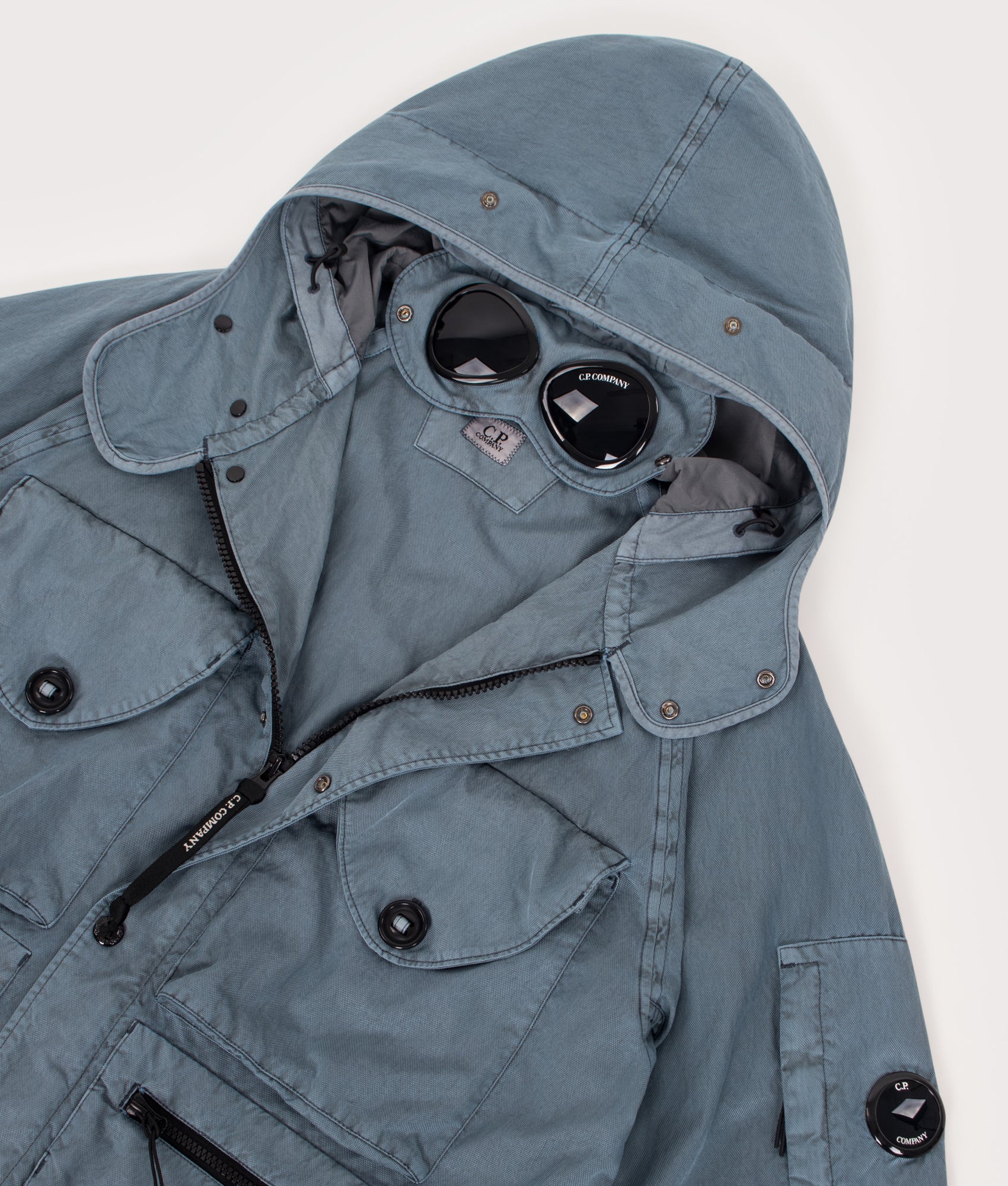 Panama-R Mixed Goggle Jacket in Silver Blue by C.P. Company. Shot by EQVVS. Detail shot.